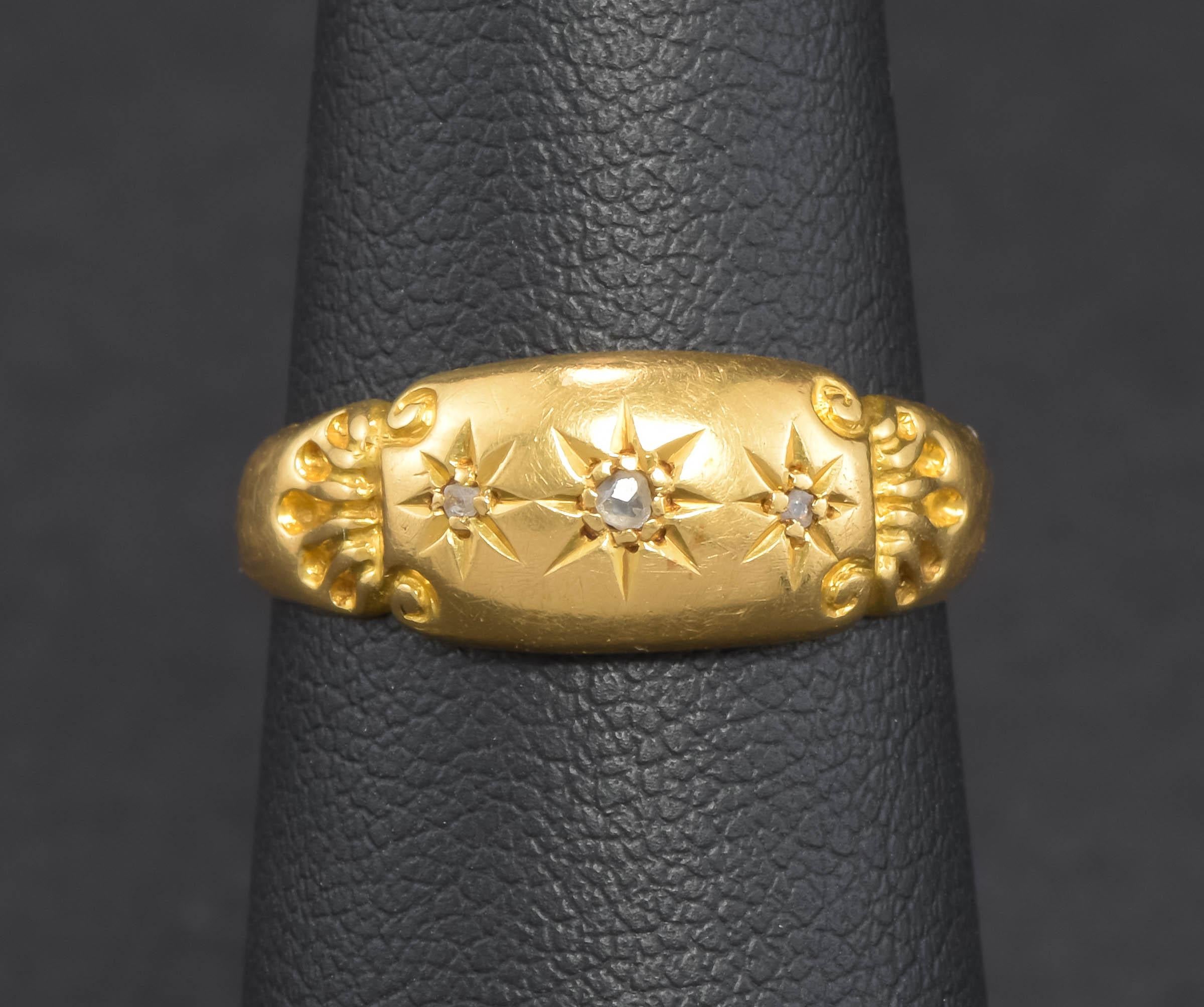 Offered is a charming Edwardian period English high karat gold diamond ring with full Chester hallmarks for 1910 - 1911.

Made of a lovely, richly hued buttery 18K gold, the band is a signet meets gypsy style ring, with three twinkly rose cut