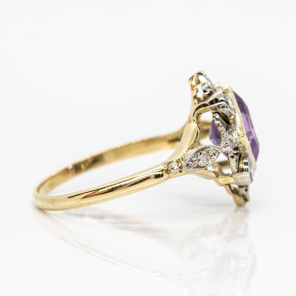Period: Edwardian (1901-1920)
Composition: 18k Gold and Platinum
•	1 natural square cut amethyst that weighs 4ctw.
•	10 old mine cut diamonds of I-VS2 quality that weigh 0.30ctw
Ring size: 6 ½ 
Ring face measure: 20mm by 14mm
Rise above finger: