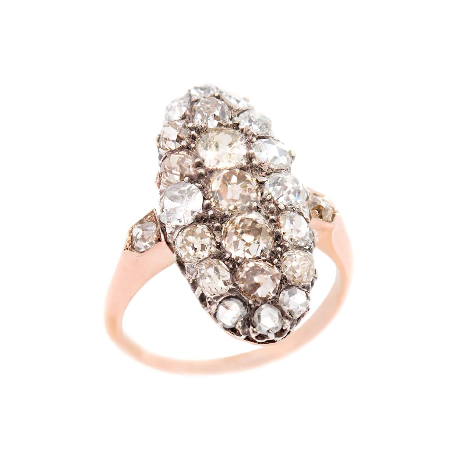 A gorgeous ring from the Edwardian (1900) era! Crafted in 18K and platinum topped this ring adorns 23 Old Mine Cut and Rose Cut diamonds totaling 2.75ctw. The mixture of natural old cuts that range in color from H-light fancy make this ring sparkle!