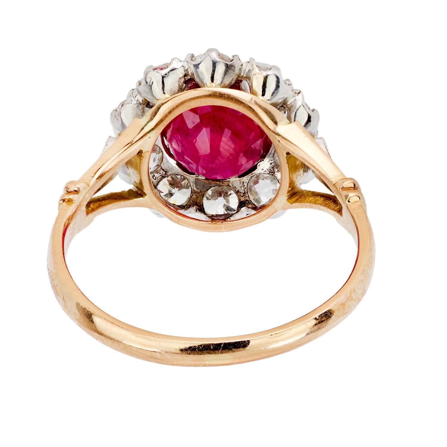 Edwardian 18k/Platinum Ruby and Diamond Halo Ring In Good Condition For Sale In Narberth, PA