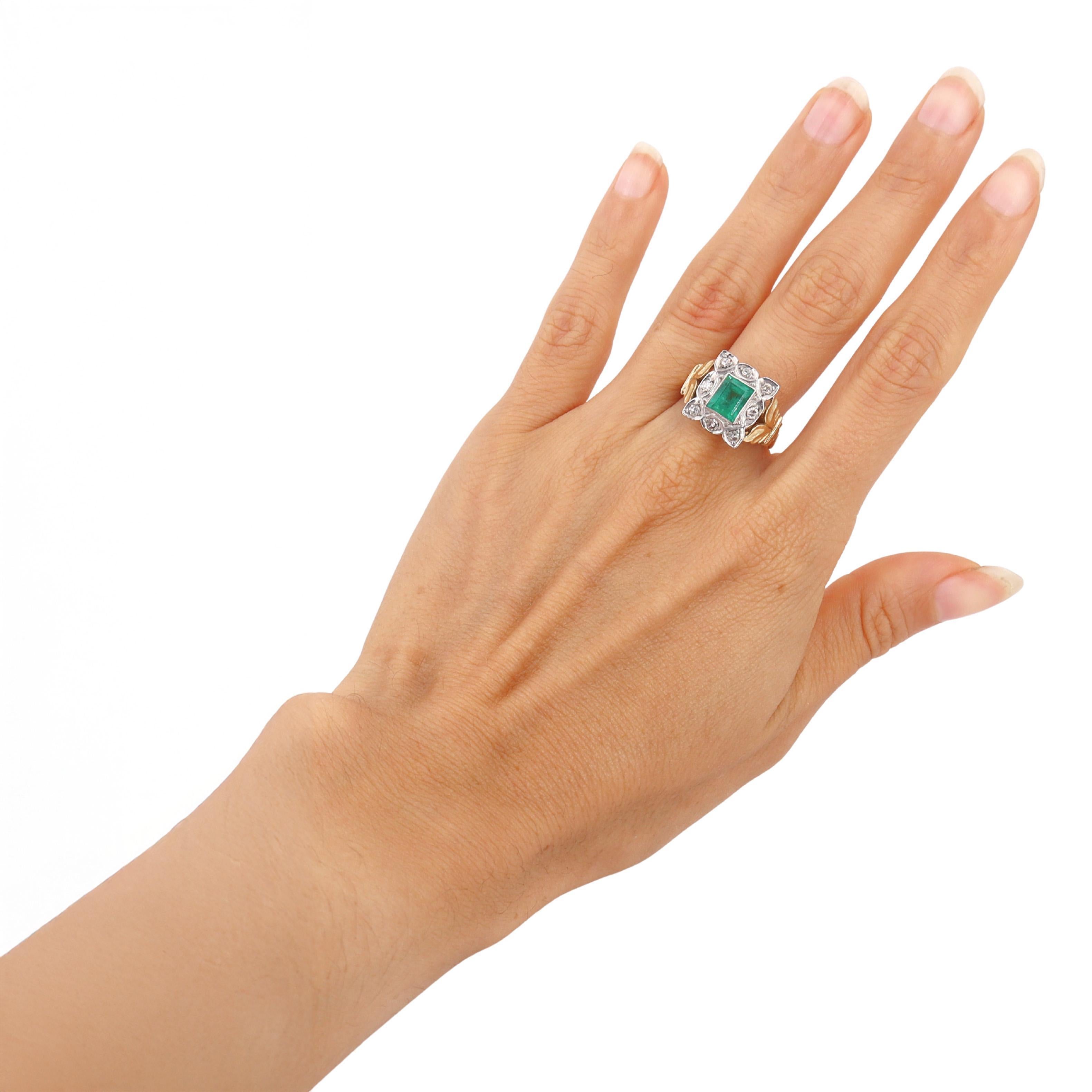 A refined example of early 20th-century craftsmanship, this Edwardian ring (circa 1900s) is beautifully crafted in 18kt yellow gold with platinum accents. The ring features a center emerald-cut natural emerald of approximately 1.05 carats, radiating