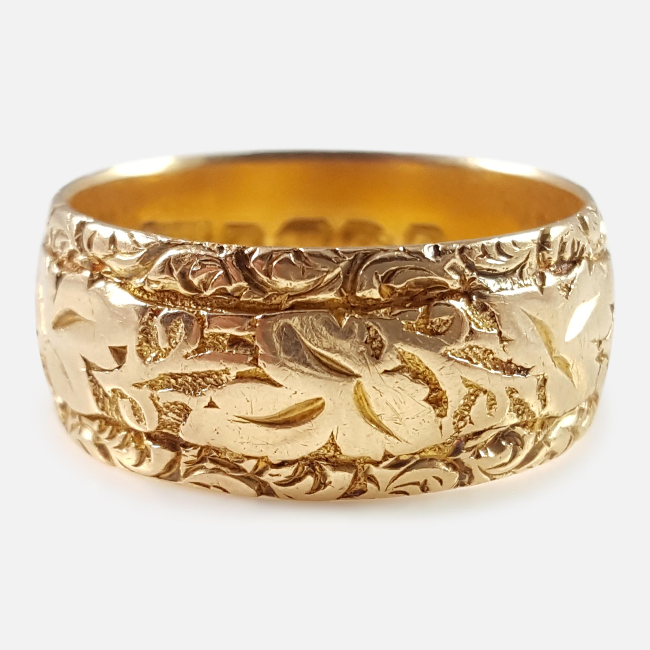 Description: - A superb antique Edwardian 18 karat yellow gold floral engraved wedding band ring. The ring is UK hallmarked with the Birmingham Assay office stamp, '18' to denote 18 karat (carat) gold, and date letter 'e' for (1904).

Assay: - .750