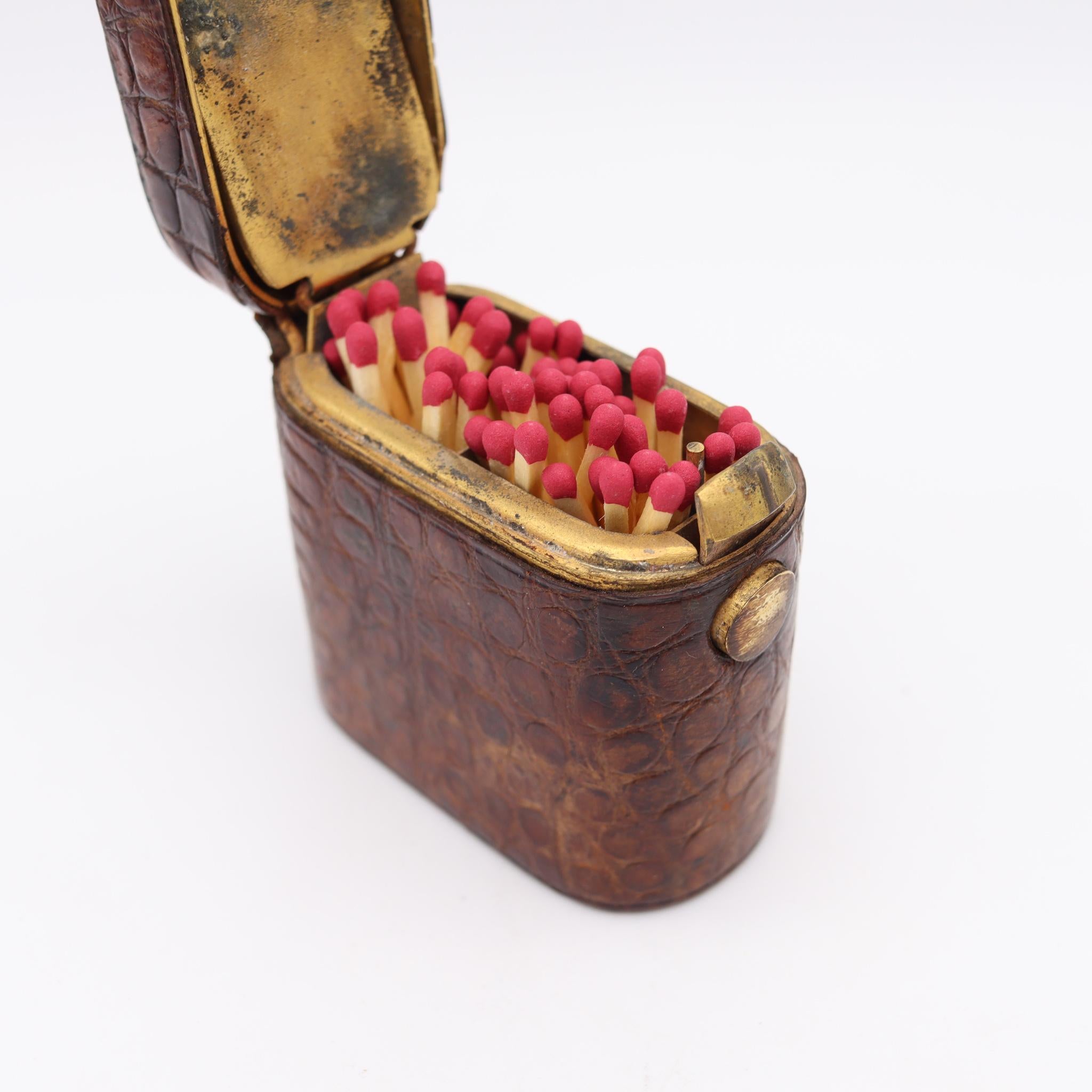 Edwardian desk matches box with crocodile leather.

Beautiful and very unusual box, created in England during the Edwardian period, back in the 1905. This is a very decorative matches holder desk box crafted in bronze and carefully embellished