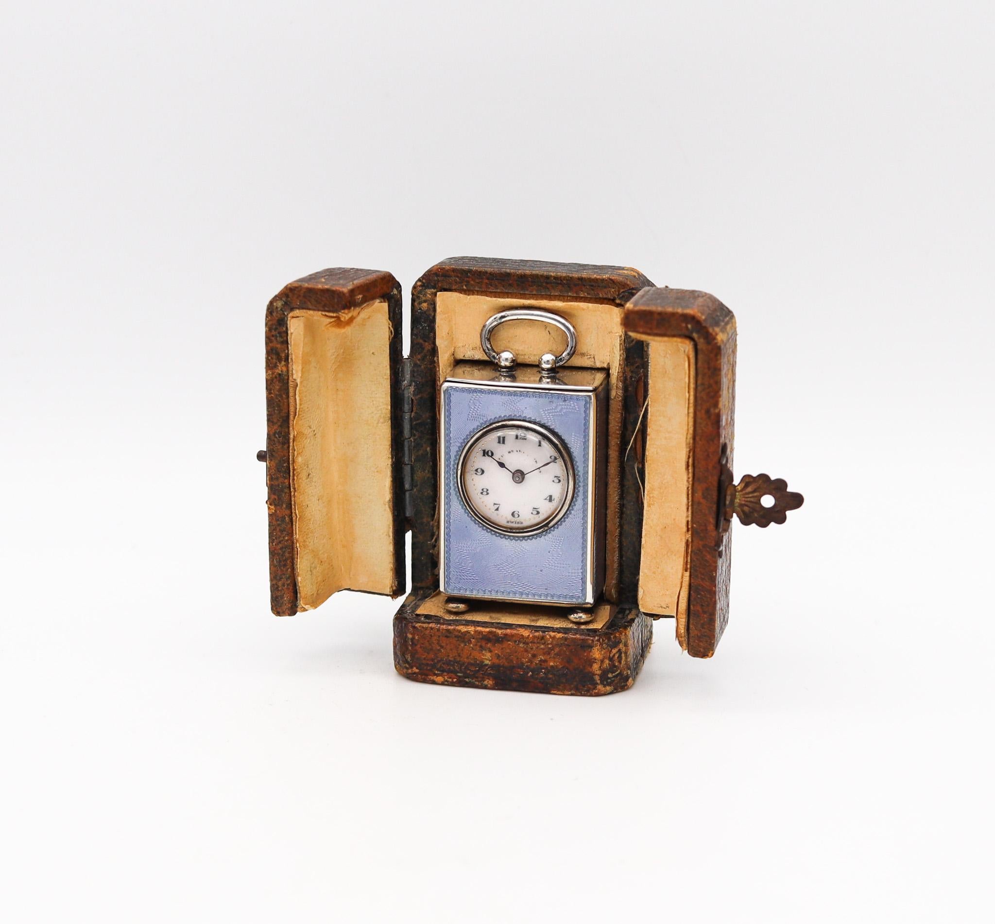 An Edwardian miniature travel clock.

An outstanding antique miniature travel-carriage boudoir clock, made in Geneva Switzerland by the Concord Watch Co. This little antique clock is exceptionally beautiful. It was created during the Edwardian and