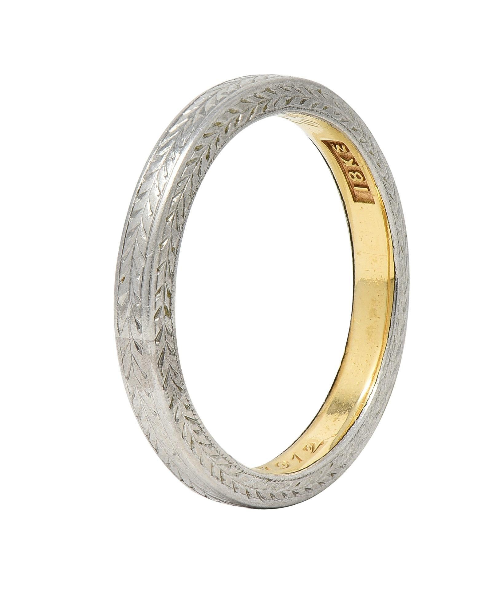 Designed as a white gold band with wheat engraving fully around
With engraved wheat motif profile 
With yellow gold inner shank 
Inscribed ' E.P.J from E.H.D June 4, 1912'
Stamped for 18 karat gold 
With maker's mark 
Circa: 1912; via dated
