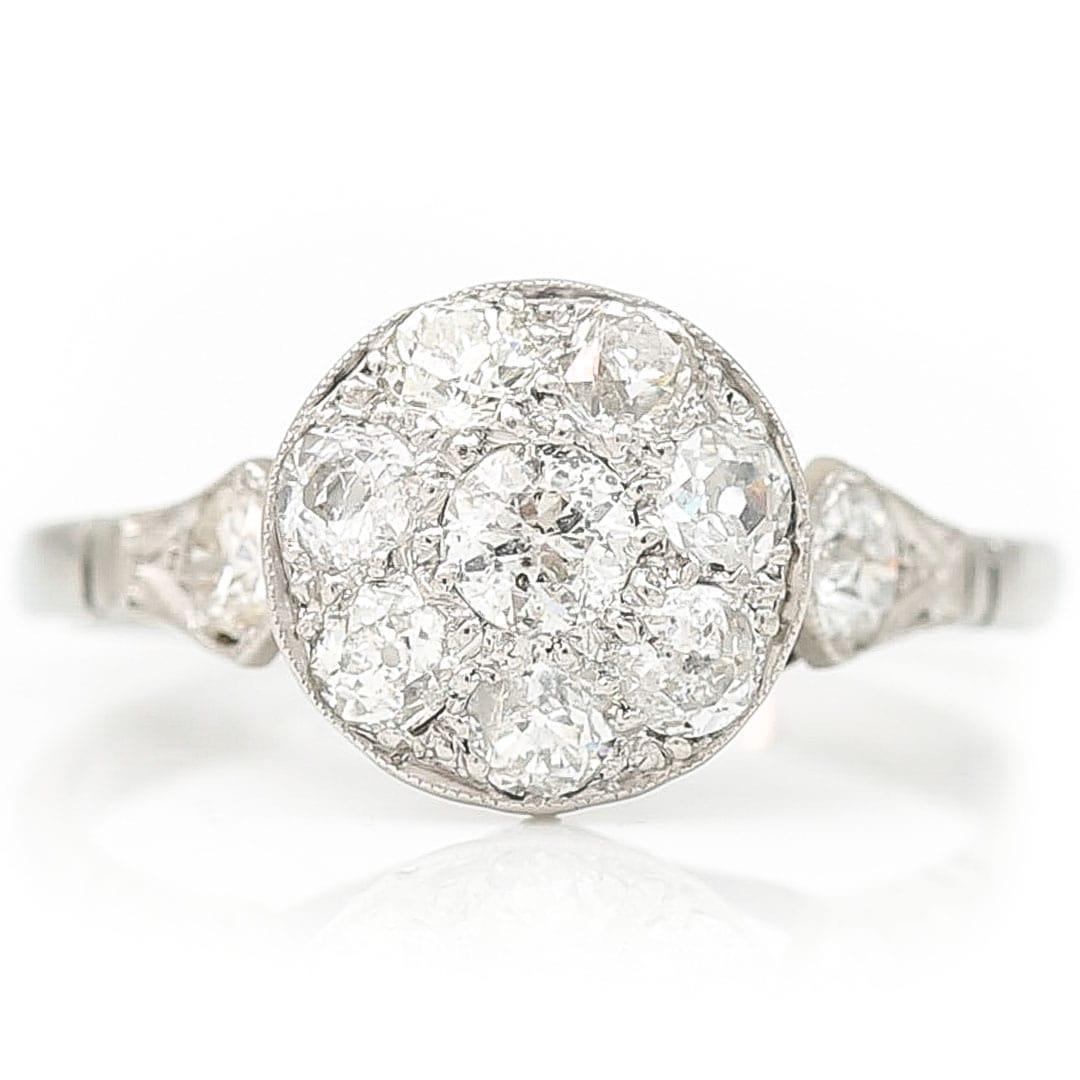A stunning statement old mine cut diamond cluster ring, set with approx 1ct of diamonds in white gold and platinum from the Edwardian era. This beautiful early 20th century diamond cluster ring is such beauty and has such an impact on the finger