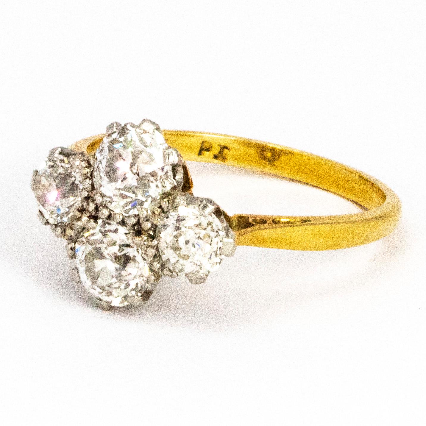 This gorgeous four stone ring holds four lovely sized diamonds. Two of which measuring 60pts and the other two 40pts each totalling 2 carats worth of diamonds in this ring. The stones are set in platinum and the shank is modelled in 18carat gold The