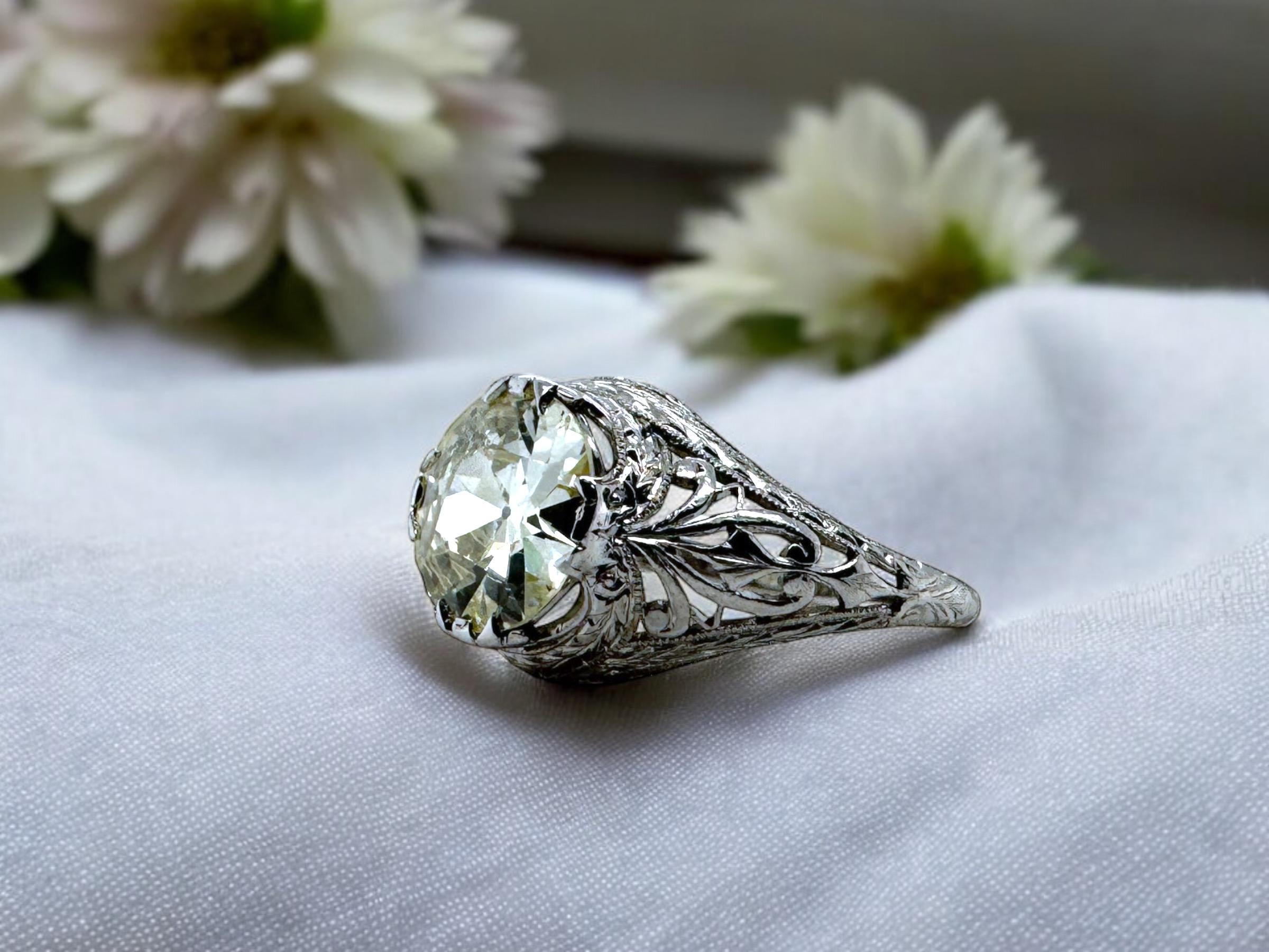 We are loving this filigree solitaire engagement ring!!
The best part?
The spread of the diamond!!
This 2 Carat Beauty has a 9mm spread, giving the same look as a 2.5 Carat!!

Ring Details
Material: Platinum
Era: Edwardian 1900 - 1920
Head Width: