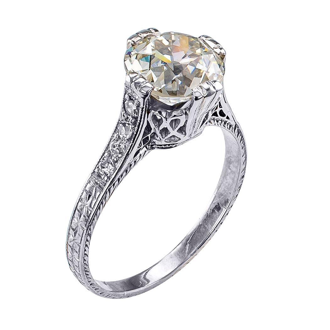 Edwardian 2.21 carats diamond and platinum engagement ring circa 1910. Centering upon a 2.21 carats old European-cut diamond accompanied by a report from EGL-USA stating that the diamond is M color and VS1 clarity, set in an Edwardian platinum