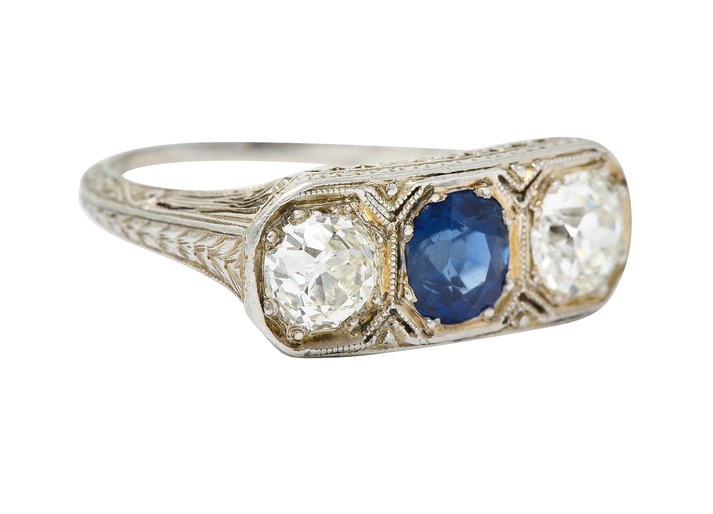 Centering an oval cut sapphire weighing approximately 1.15 carats

Bright royal blue in color with no indications of heat - Cambodian in origin

With two old European cut diamonds weighing approximately 1.15 carats - J/K color with VS clarity

Bead