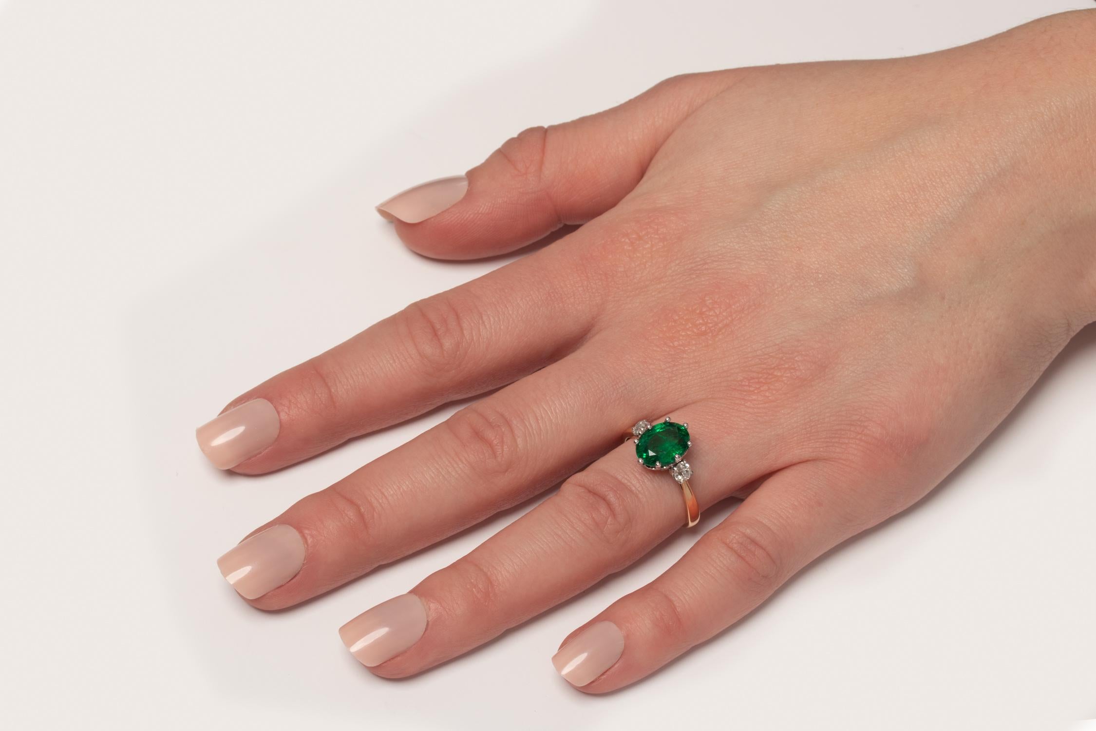 Oval Cut Edwardian 2.35ct Emerald and Diamond Three Stone Ring, c.1910s For Sale