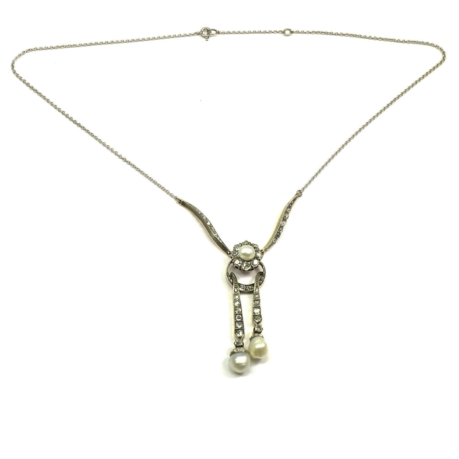 Edwardian 2.6 carat diamond and natural pearl Lavalier Necklace circa 1910

This decorative Lavalier necklace is designed as a pendant on diamond-set decorative motifs with a flower motif and two long movable pendants. Set with 69 diamonds with a