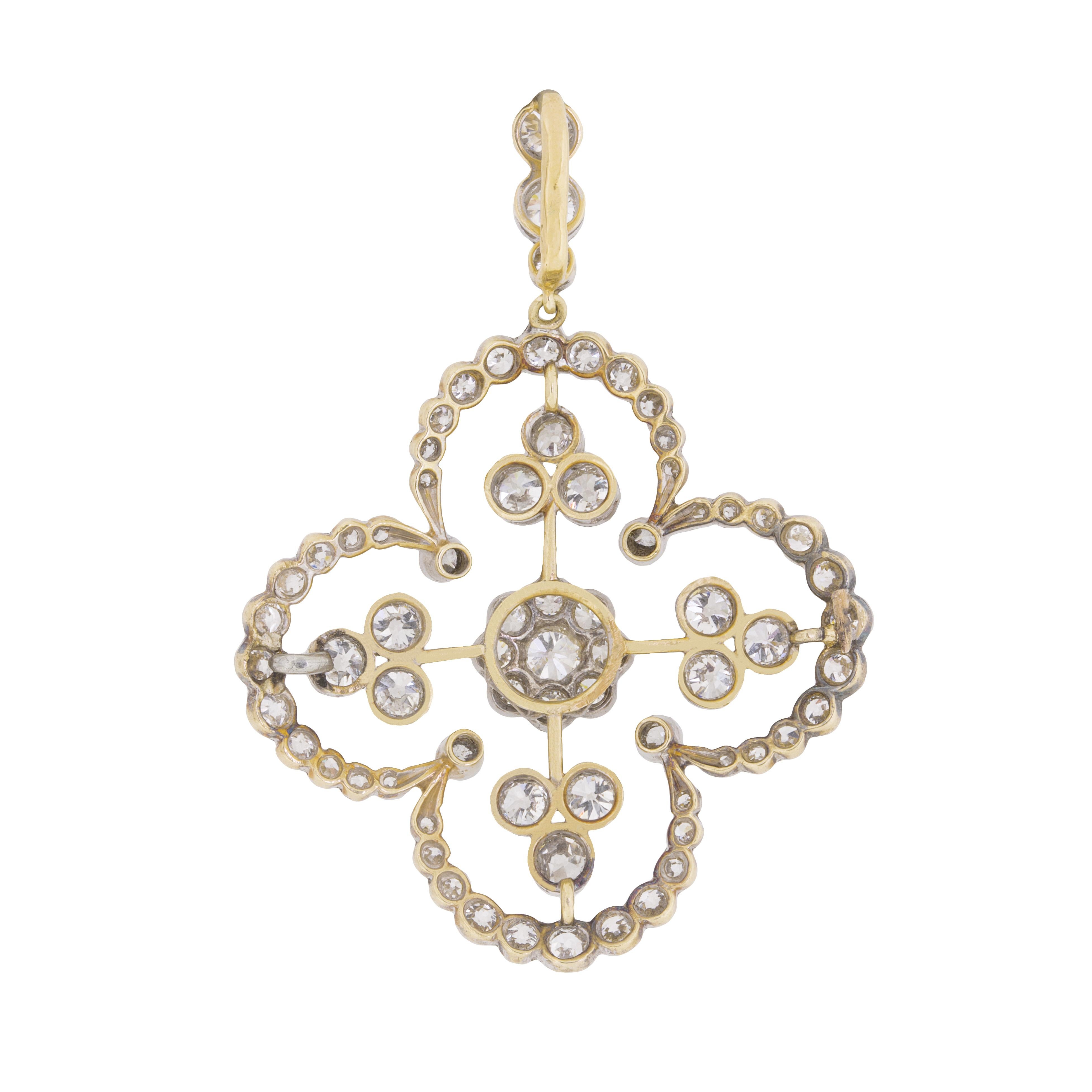 This stunning pendant features a total of 2.60 carat's worth of hand cut, old cut diamonds. They are beautifully crafted and estimated as F to G in colour, with a clarity of VS2. They have been wonderfully rub over set in a slight floral design,