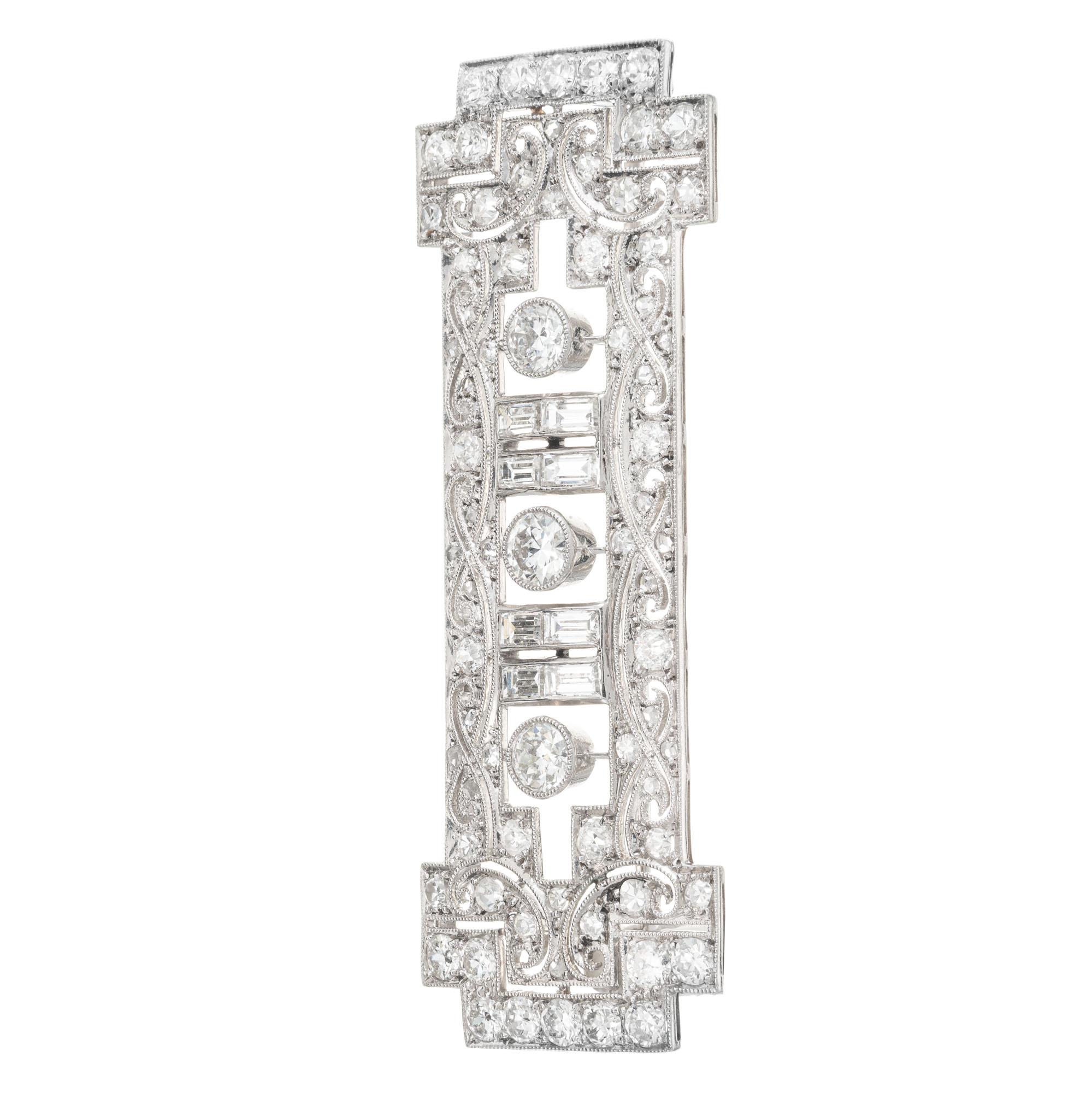Vintage Edwardian handmade diamond bar brooch. 2.75cts of old European, baguette and round diamonds in a pierced open work platinum setting. circa 1910

3 Old European cut diamonds, G-H VS-SI approx. .75cts
8 step cut baguette diamonds, H VS approx.