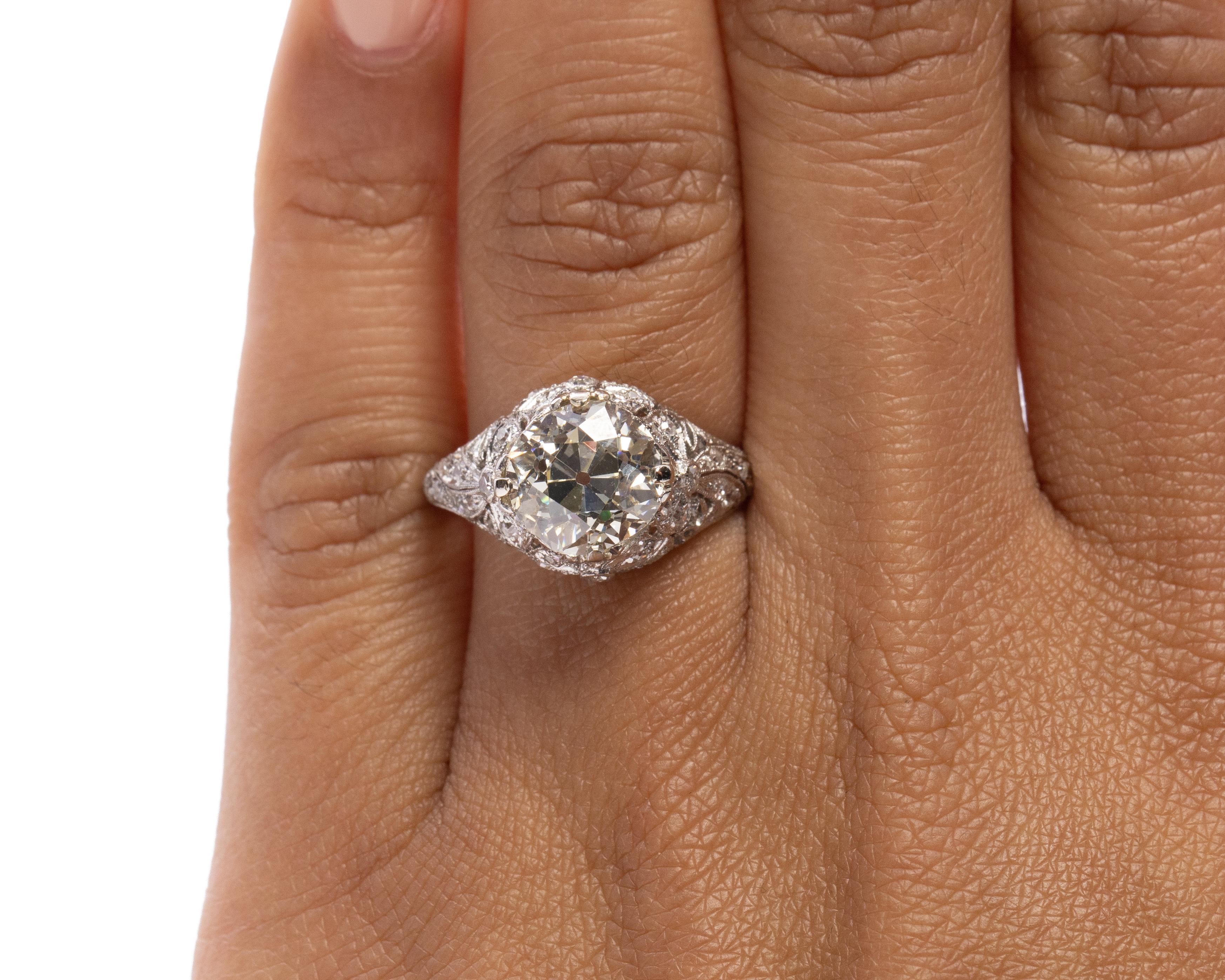 Women's Edwardian 2.89 Carat GIA Diamond Platinum Engagement Ring with Carved Bow Motif