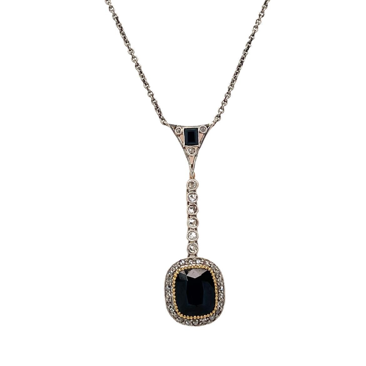 Genuine antique 1900's Edwardian gold necklace featuring one large cushion Natural Sapphire, 3 carats and adorned by sparkling single-cut diamonds, total weight 0,50 carats.

This jewel is authentic in every part, the engraving and filigree make it