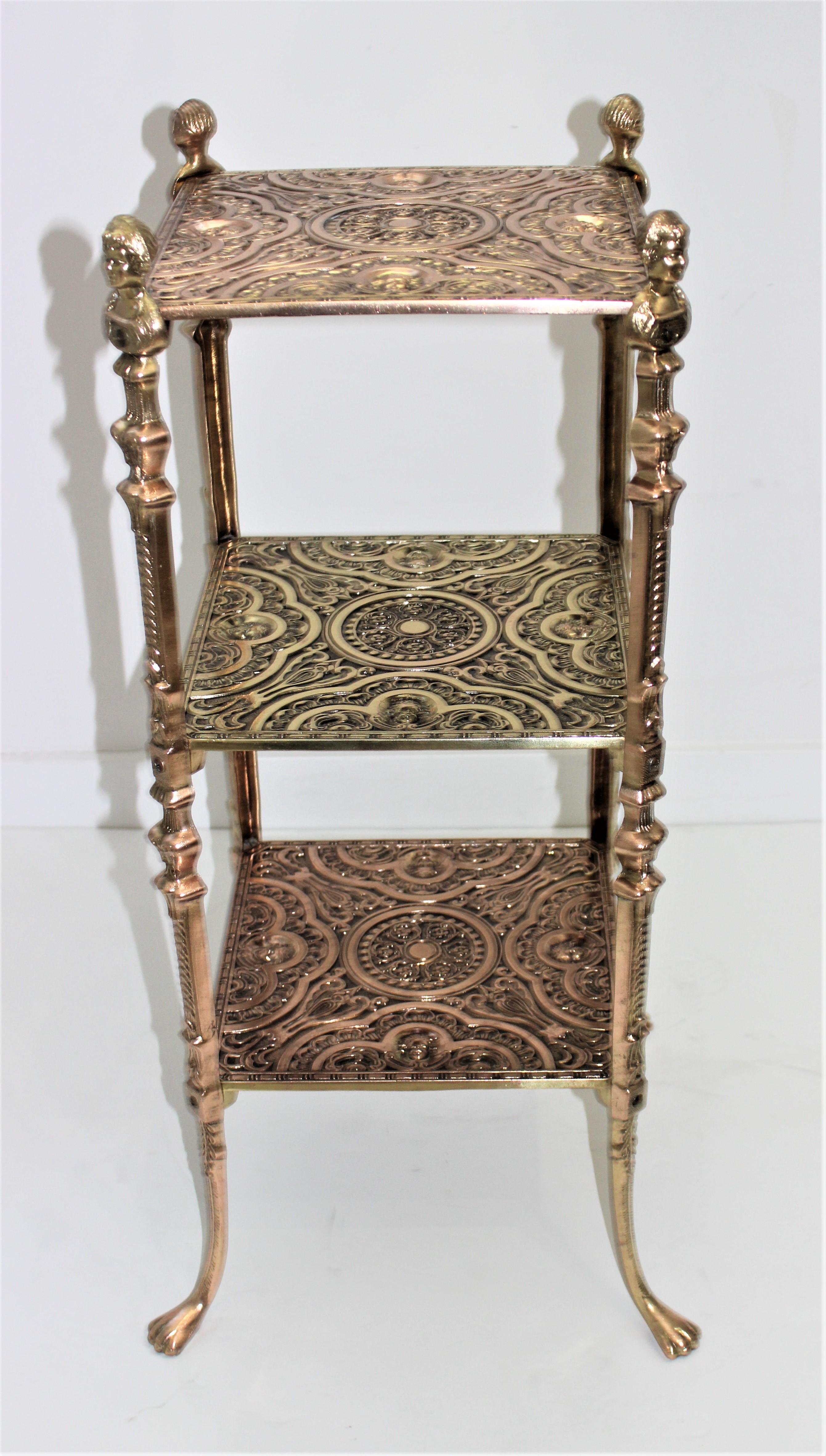 Elegant and charming Edwardian 3-tiered side table aesthetic movement ornate polished brass and copper from a Palm Beach estate.

Overall size is 14.5 inch square x 29.25