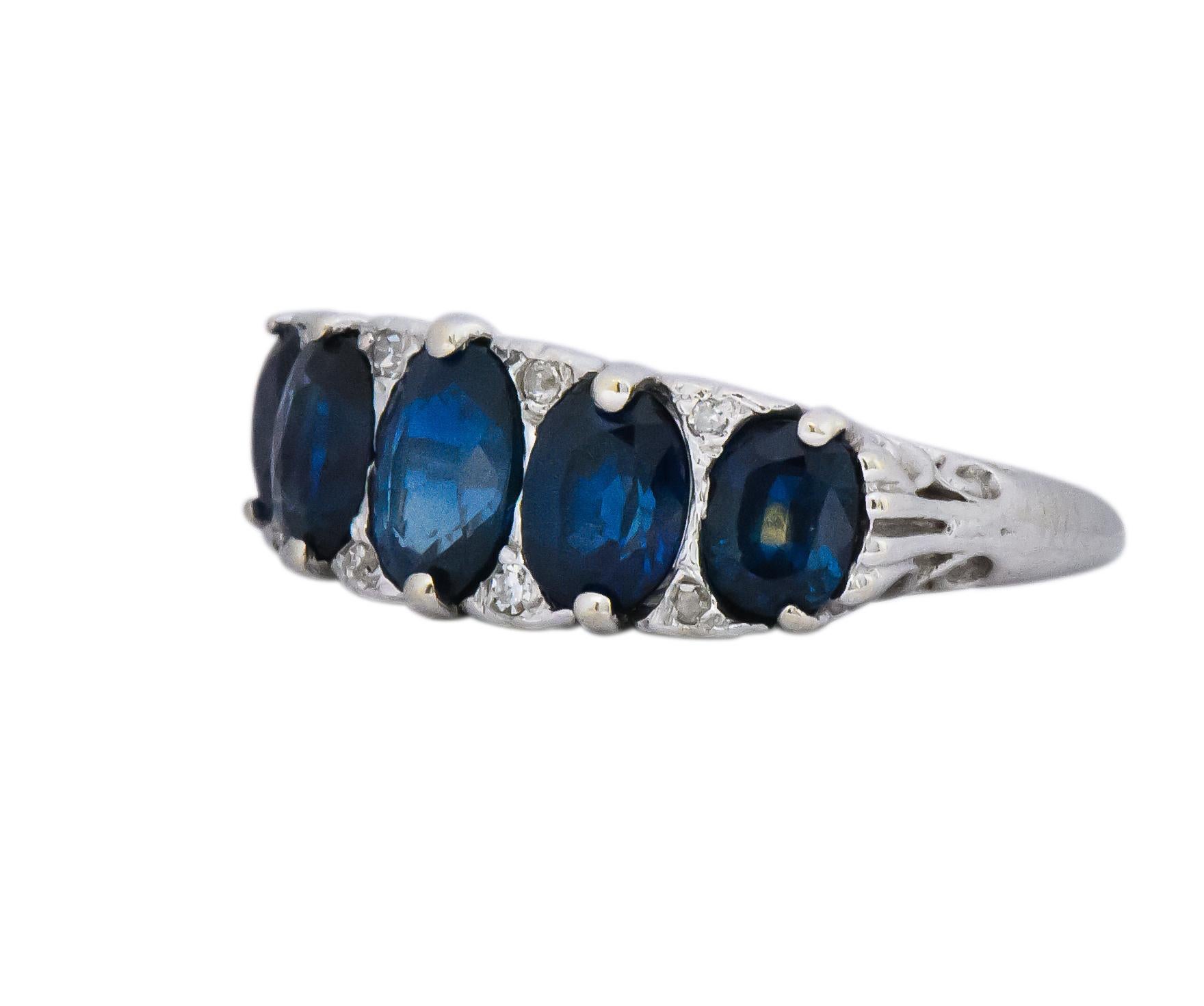 Set to the front with 5 graduated oval cut sapphires, weighing approximately 3.00 carats, deep bright blue and well matched

Accented by single cut diamonds, weighing approximately 0.05 carat total, eye-clean and white

Tested as 14 karat

CTW: