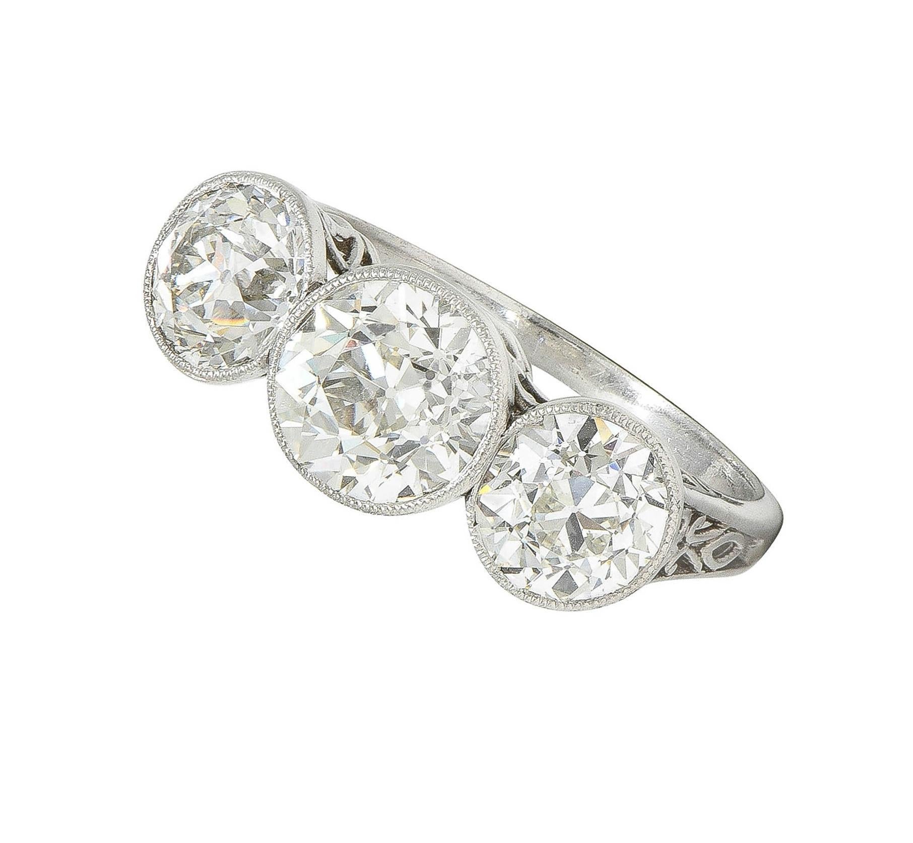 Edwardian 3.10 CTW Old Mine Cut Diamond Platinum Antique Three Stone Ring For Sale 6