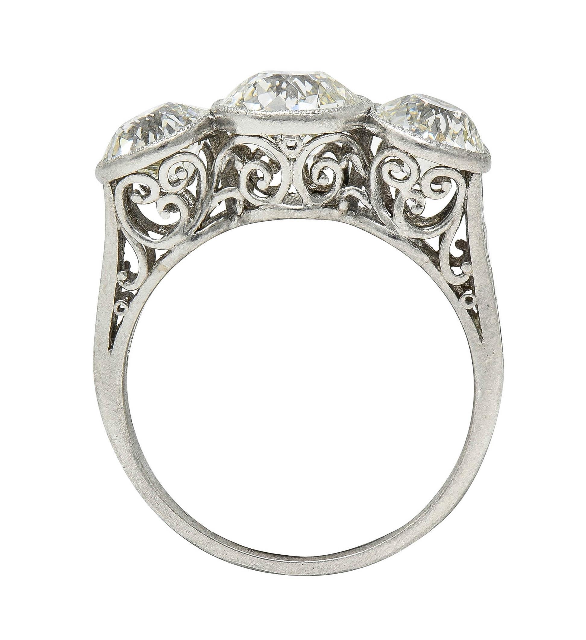 Women's or Men's Edwardian 3.10 CTW Old Mine Cut Diamond Platinum Antique Three Stone Ring For Sale
