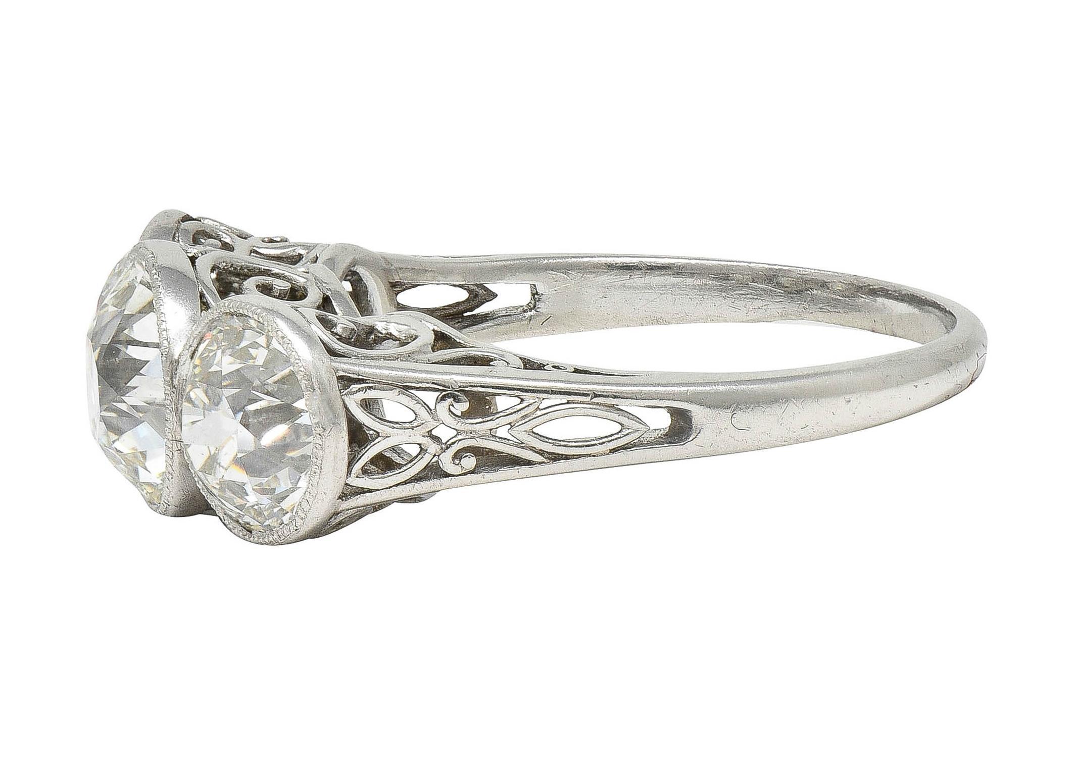 Edwardian 3.10 CTW Old Mine Cut Diamond Platinum Antique Three Stone Ring For Sale 2