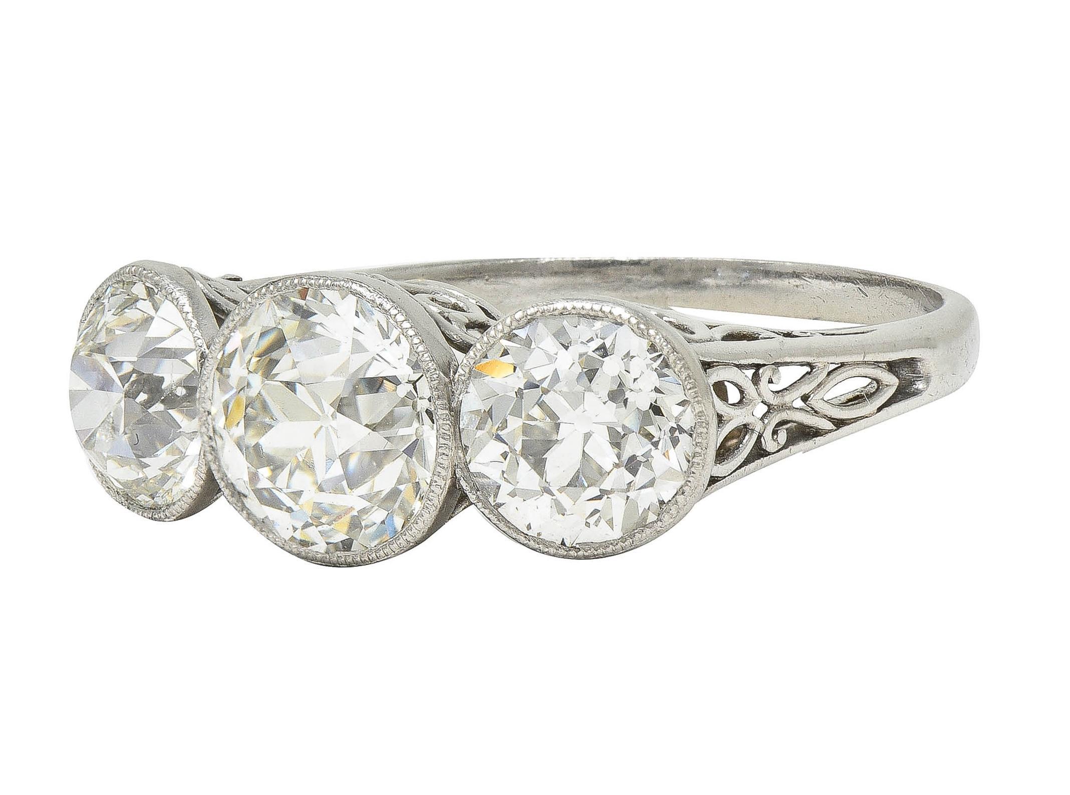 Edwardian 3.10 CTW Old Mine Cut Diamond Platinum Antique Three Stone Ring For Sale 3