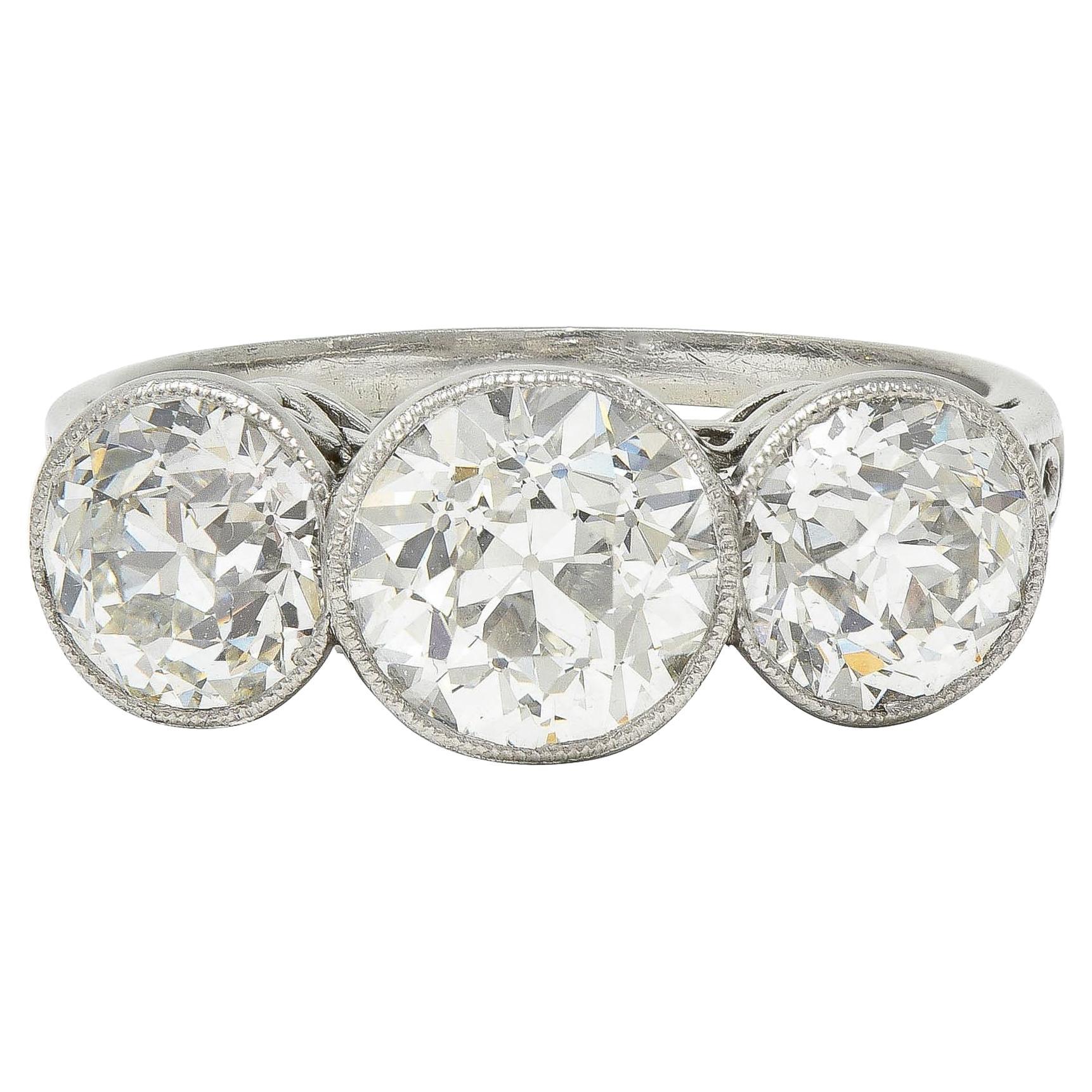 Edwardian 3.10 CTW Old Mine Cut Diamond Platinum Antique Three Stone Ring For Sale