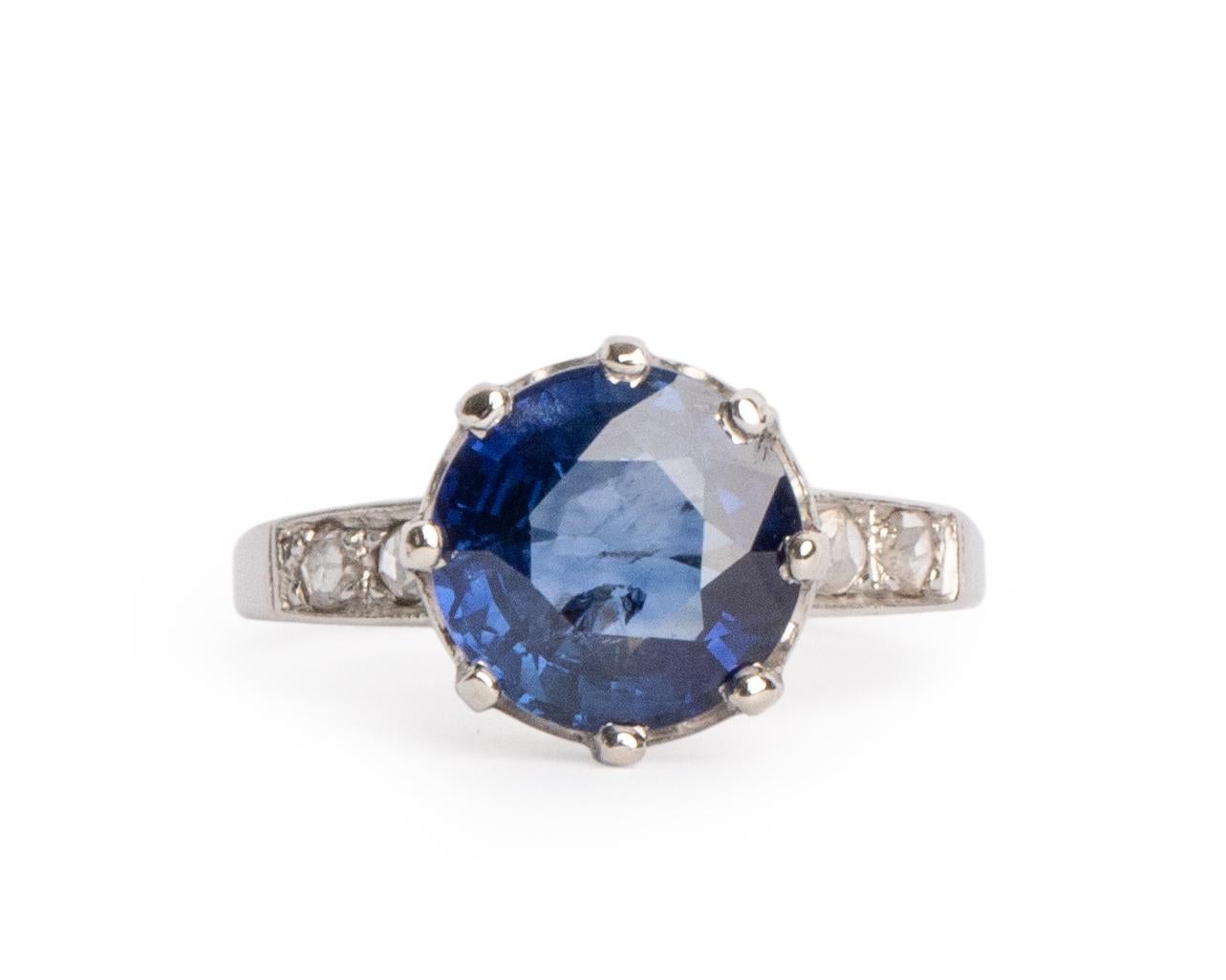 This is an gorgeous example of an Edwardian era sapphire ring! The stunning 3.51 carat deep royal blue sapphire sits proudly in a crown like eight prong solitaire head! Adding to the already impressive history of this piece is the fact the that the