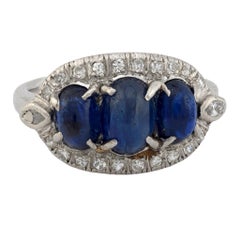 Edwardian 3.20 carat cabochon cut sapphire diamond platinum 3 stone ring