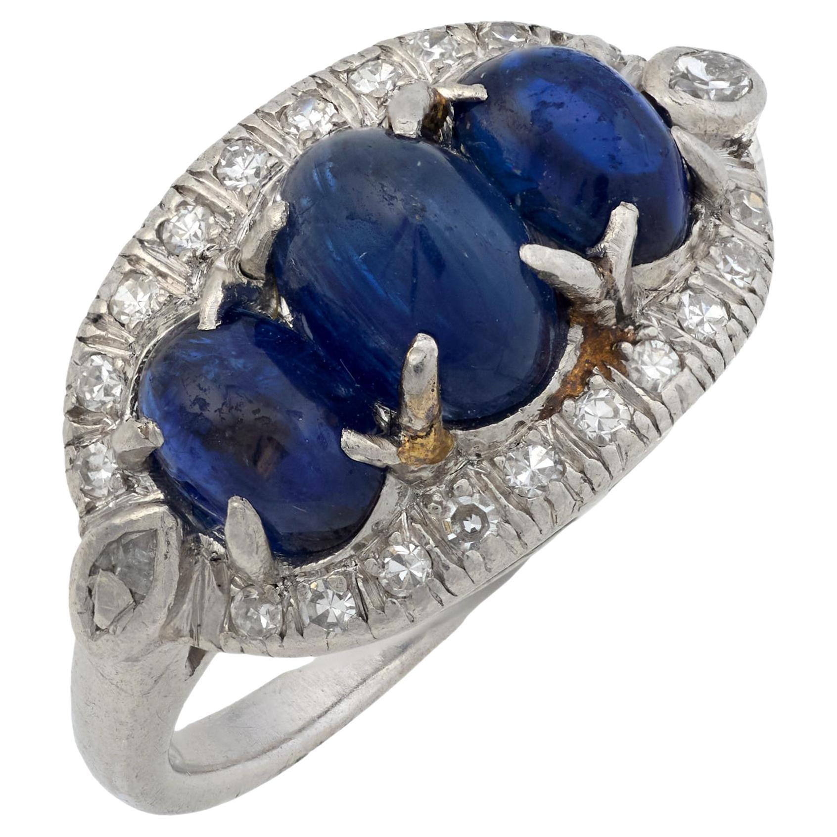 Edwardian 3.20 carat cabochon cut sapphire diamond platinum 3 stone ring For Sale