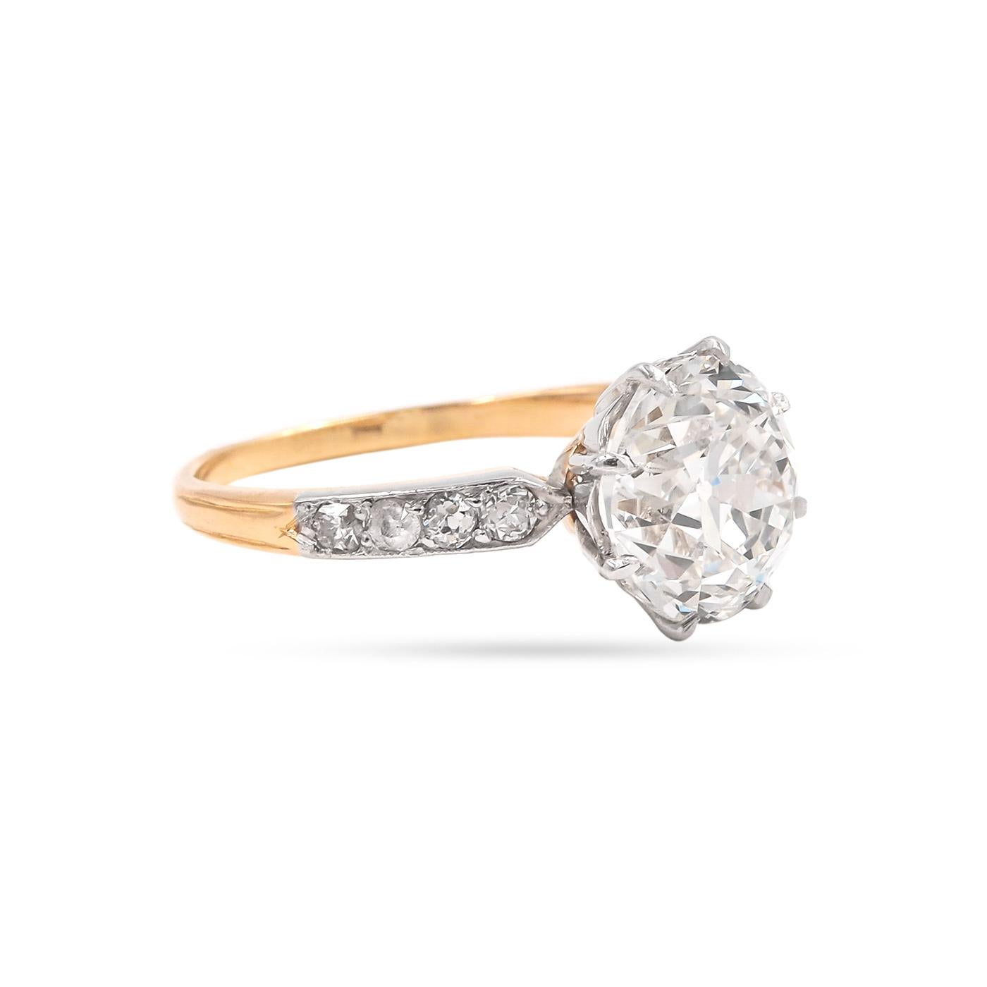 Edwardian era 3.23 Carat Old European Cut Diamond Ring composed of 18k yellow gold and platinum. GIA certified J color/VVS2 clarity. With an additional 8 Old Mine Cut diamonds weighing approximately 0.28 carats in total on the shoulders. Platinum
