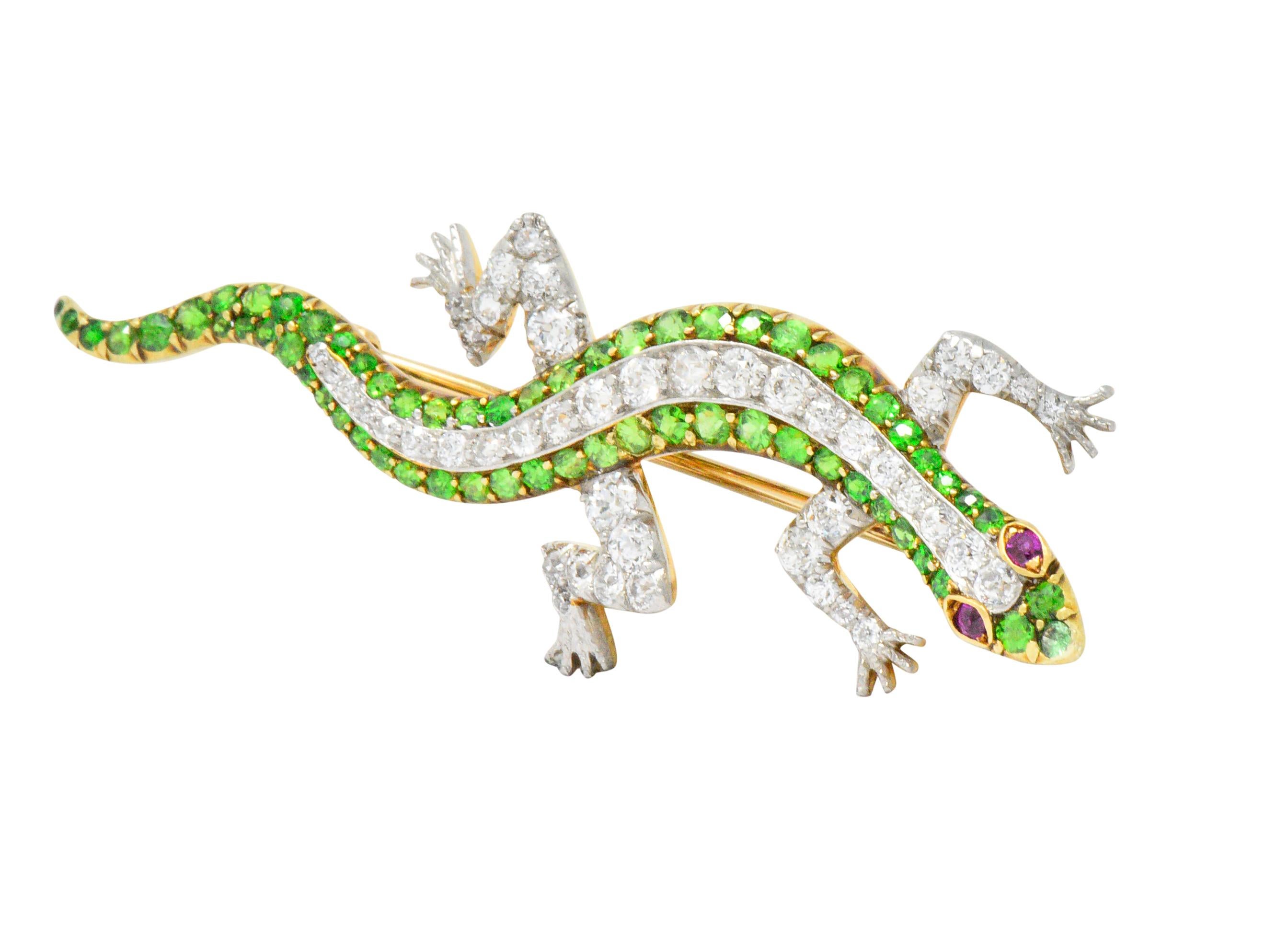 Delightfully designed lizard with old European cut diamonds set on the back and limbs, weighing approximately 1.50 carats

Featuring a body set with old European cut demantoid garnets weighing approximately 1.85 carats total, bright sparkling vivid