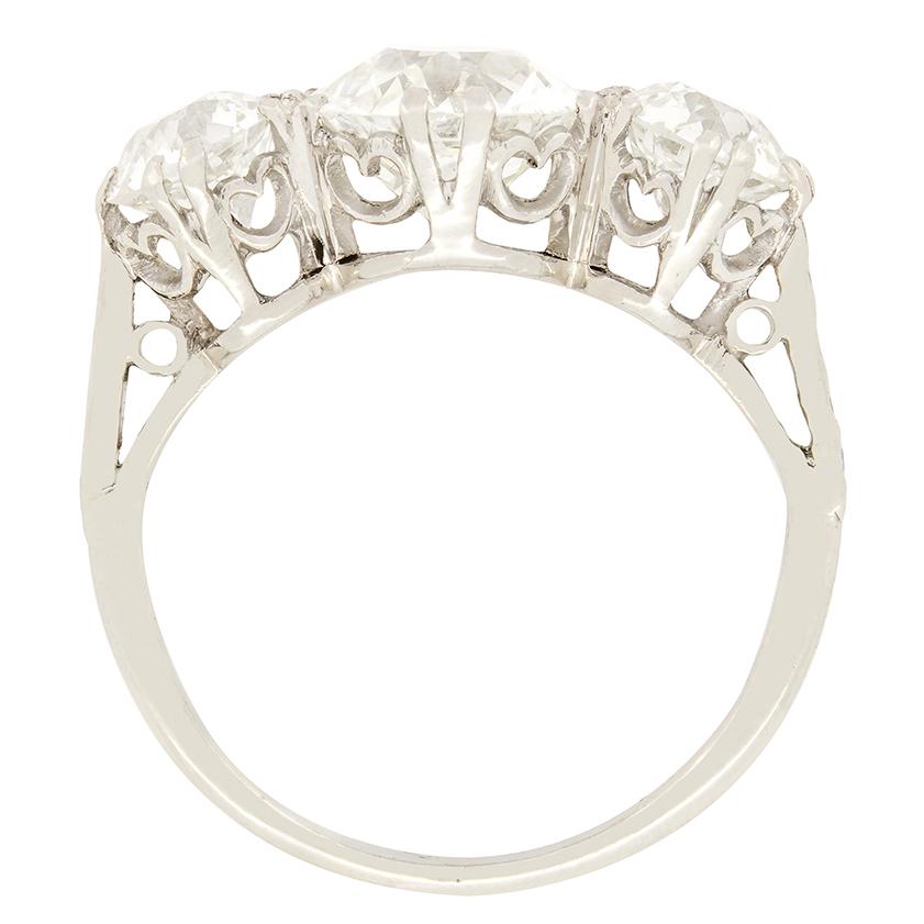 This stunning trilogy ring features three incredible old cut diamonds. The centre diamond weighs 2.00 carat, with the two flanking stones weighing 0.75 carat a piece. They all range from G to H in colour and VS-SI in clarity. These stones are claw