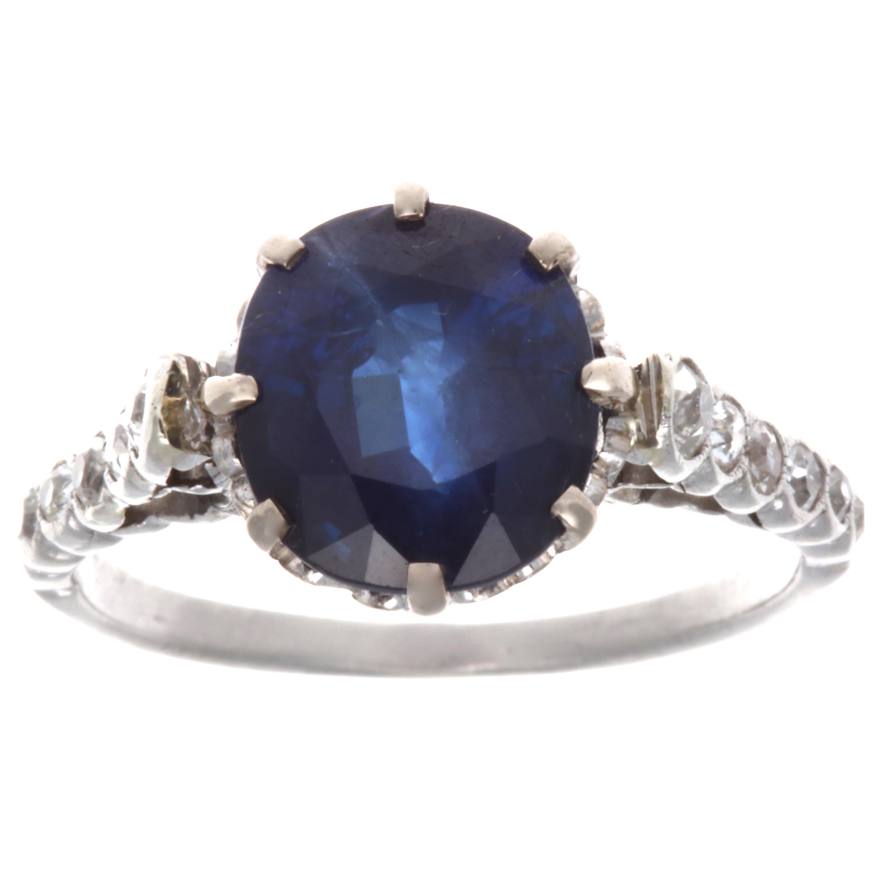 From the Edwardian era this fine 3.58 carat sapphire exhibits a rich pure blue translucent color. Accented by round cut diamonds on the platinum ring. Ring size 5 1/2 and may be re-sized to fit. 
Flawless Protection Plan: 
7 day return policy for
