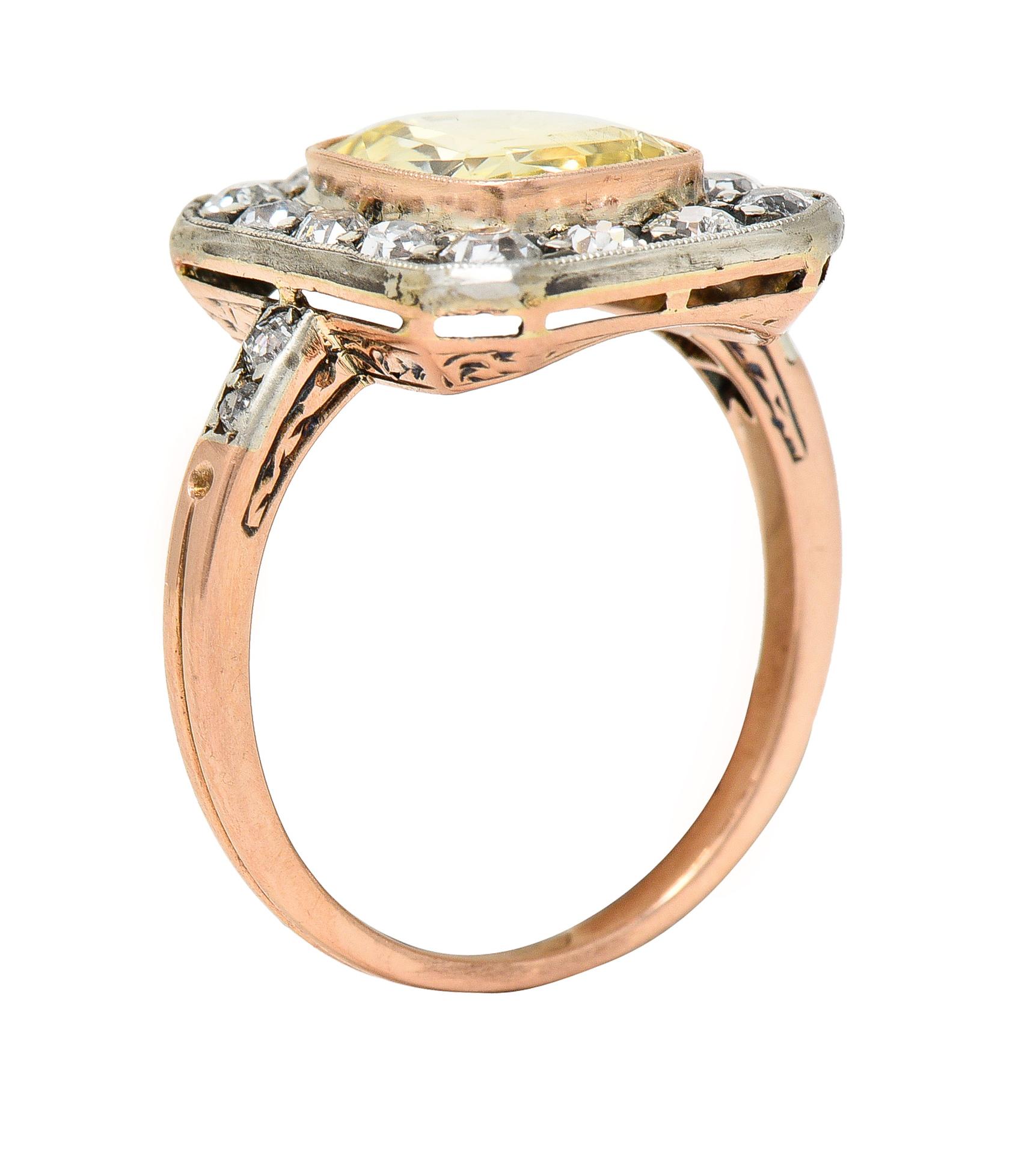 Centering a cushion cut sapphire weighing 2.95 carats - transparent light yellow in color
Natural with no indications of heat treatment - bezel set in rose gold 
With a platinum-topped halo surround of bead set old European cut diamonds 
With