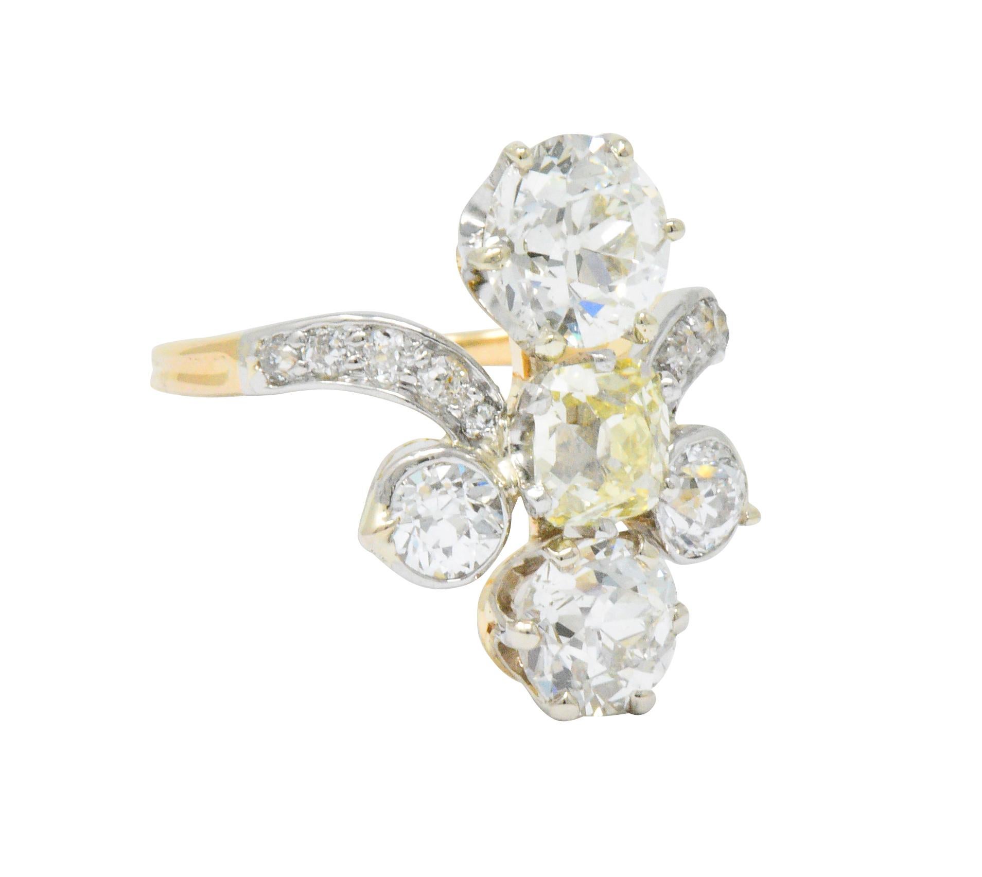 Centering an old square cushion cut diamond, light yellow color and VS clarity

With two old European cut diamonds weighing 1.40, 0.90 carats, J/K color and SI1 clarity

Accented with old mine and Swiss cut diamonds weighing approximately 0.80 carat