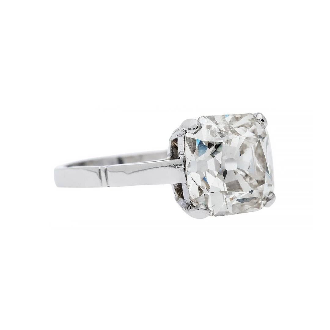 A mesmerizing old mine cut diamond that allows you to look deep within the stone to appreciate all its beauty inside and out. A classic solitaire engagement ring featuring a 3.98 carat old mine cut diamond. Hand crafted in platinum.

Ring size 7 and