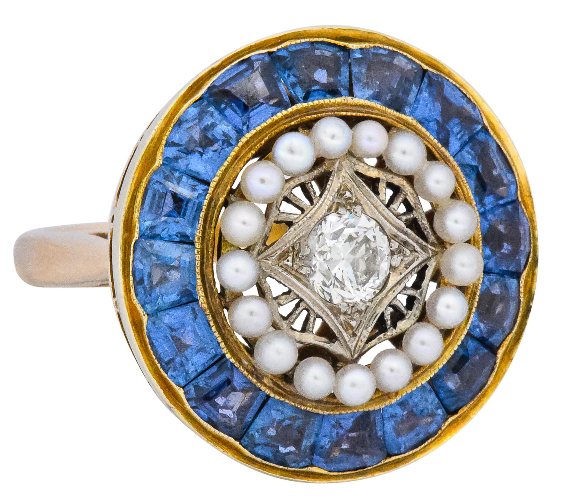 Centering a transitional cut diamond weighing approximately 0.50 carat, H color and SI clarity, set in pierced platinum

Encircled by natural freshwater pearls

Outer circle of calibré sapphires, medium-light powder blue color, approximately 3.50