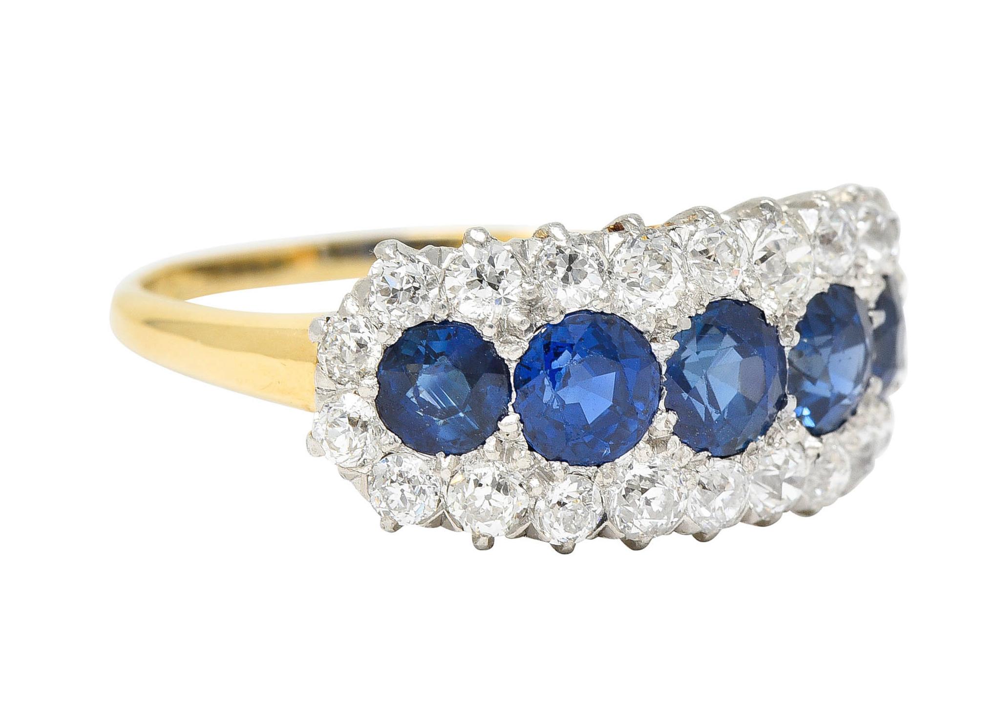 Designed as an elongated East to West cluster that features five round cut sapphires

All are a very well matched bright royal blue while weighing in total approximately 2.70 carats

Surrounded by an old European cut diamond halo - set in