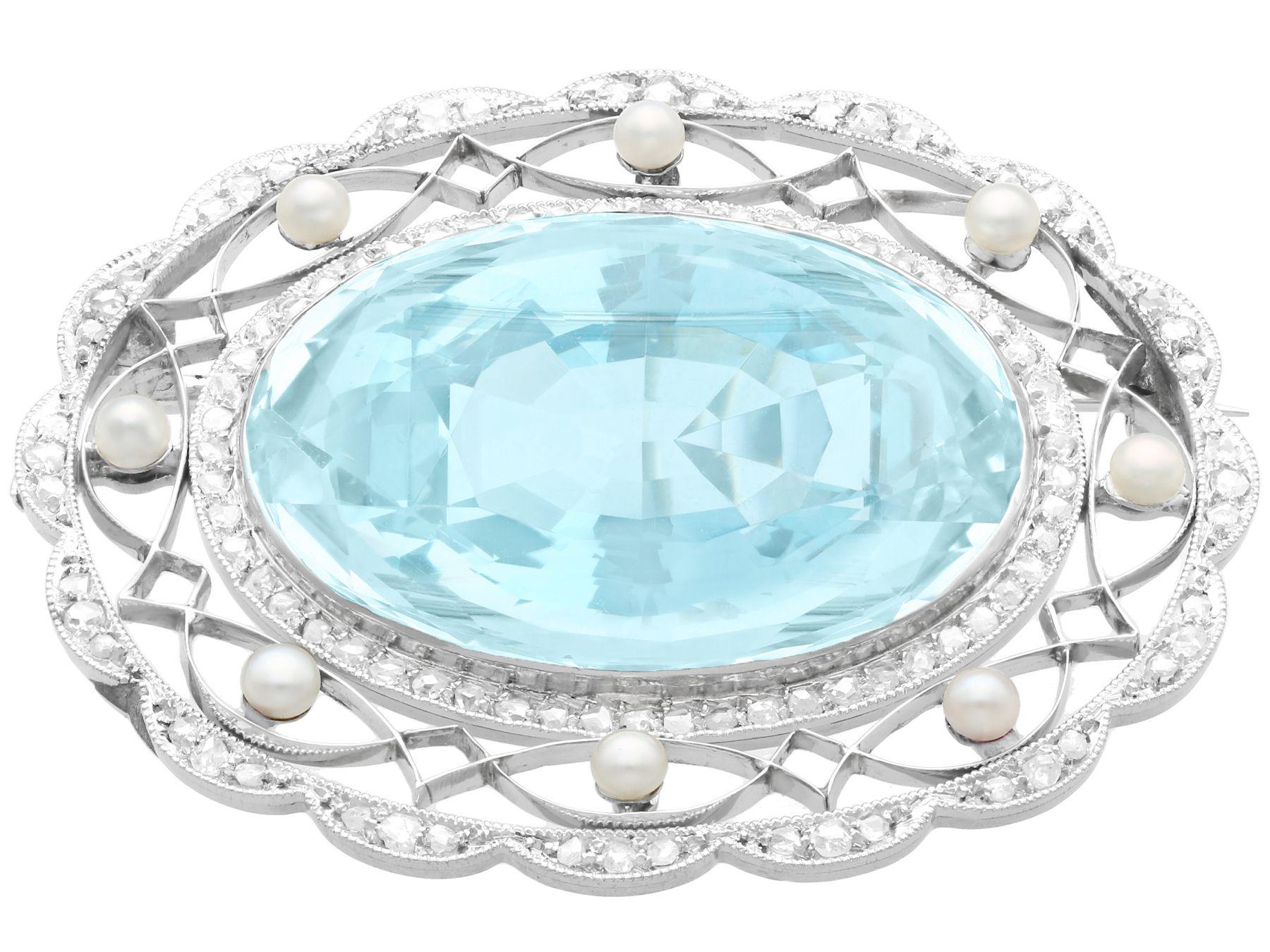 A stunning antique 43.84 carat oval cut aquamarine, 0.85 carat diamond and pearl, platinum and silver set brooch; part of our antique jewelry and estate jewelry collections.

This stunning, fine and impressive antique aquamarine brooch has been