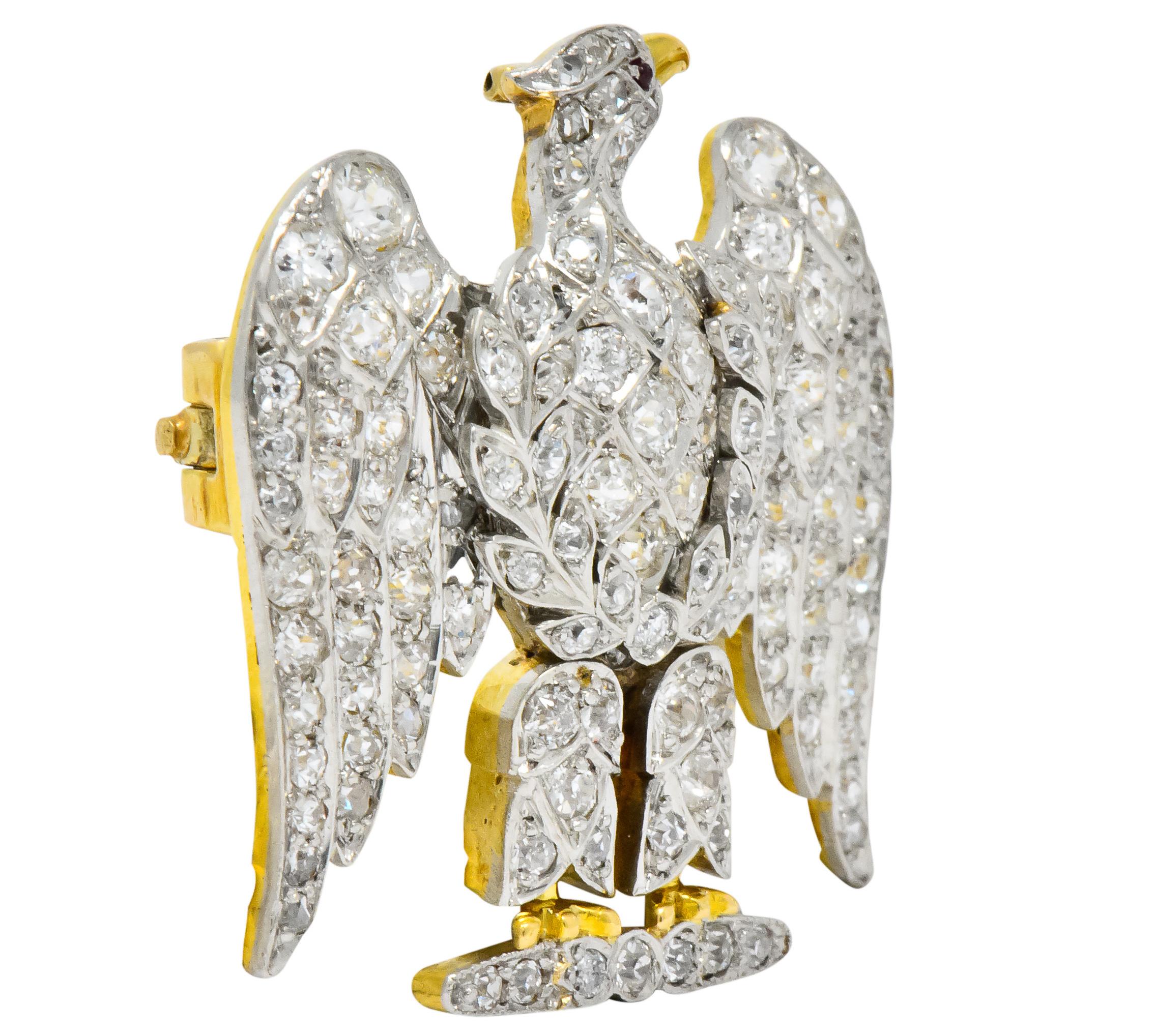 Depicting an eagle with laurel branches  

Set with old European, old mine and single cut diamonds

Total diamond weight approximately 4.50 carats, GHI color and VS to SI clarity

With tiny round ruby cabochon eye

Gold beak and talon detail

Tested