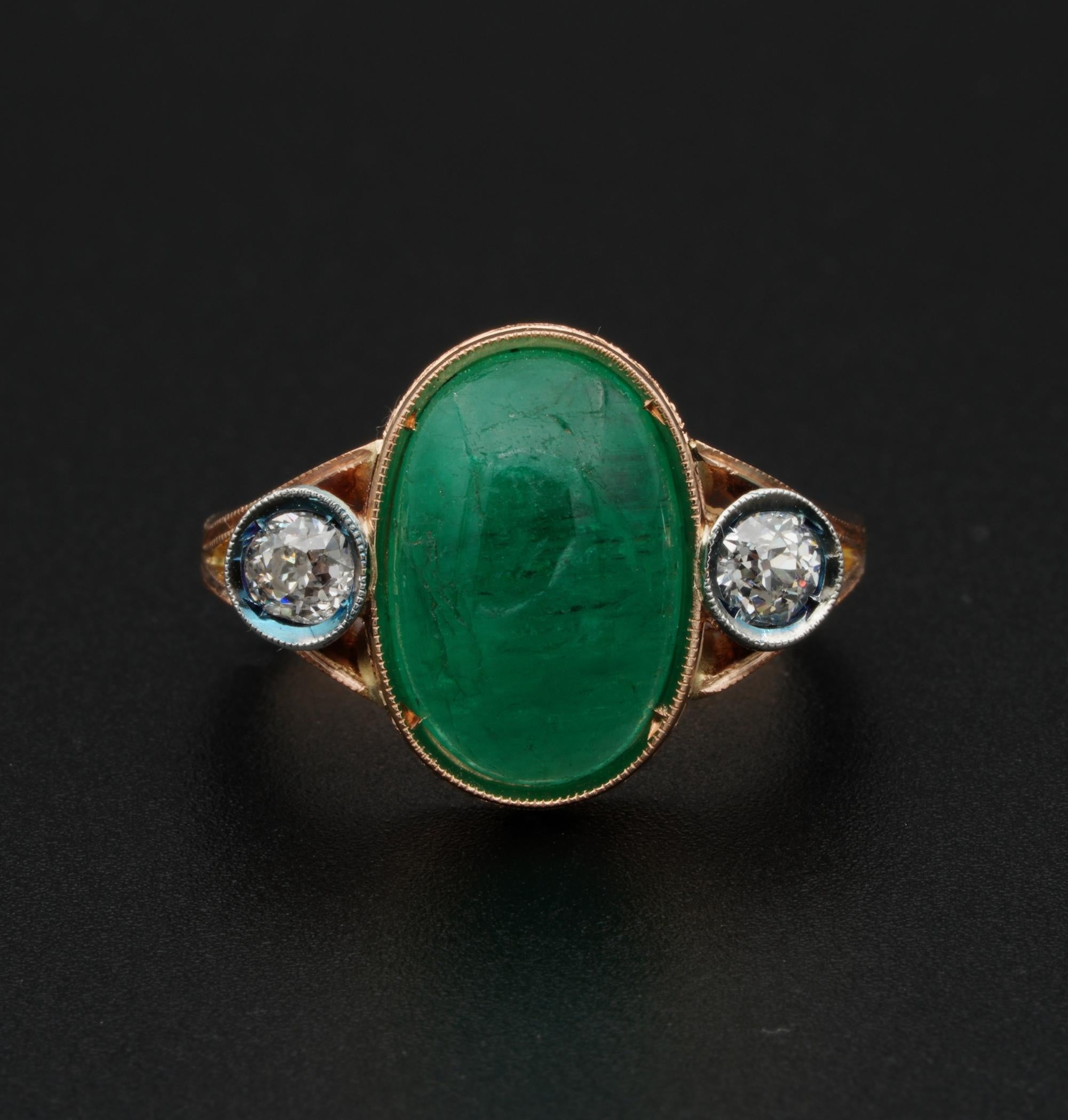 Green Desires

Attractive Edwardian era three stone ring in transition to the Victorian era – 1900 ca.
Beautiful rich gold colour setting of solid 18 KT gold boasting finest past workmanship, with carving details and lovely design
The main stone is