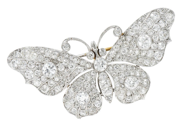 Brooch is designed as a butterfly with spread wings

With bezel set old European cut diamonds weighing in total approximately 1.55 carats

Wings and thorax bead set with additional old European cut diamonds

Weighing in total approximately 3.20