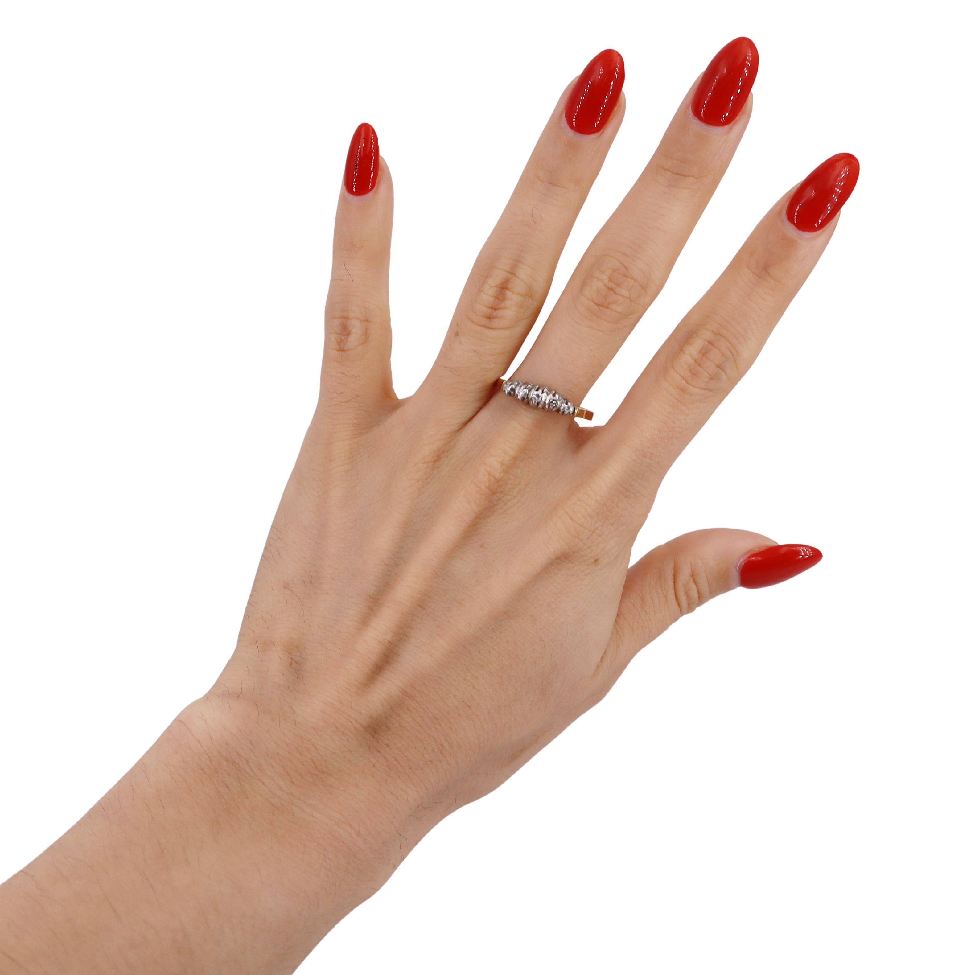 Step back in time with this exquisite Edwardian-era ring from the 1910s, a stunning example of vintage elegance and craftsmanship. This ring is meticulously crafted in 18kt yellow gold and platinum, showcasing a harmonious blend of two precious