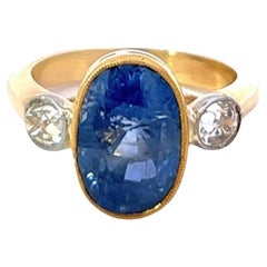 Edwardian 5.85 Carat Oval Cut Sapphire Diamond 18K Yellow Gold Three Stone Ring