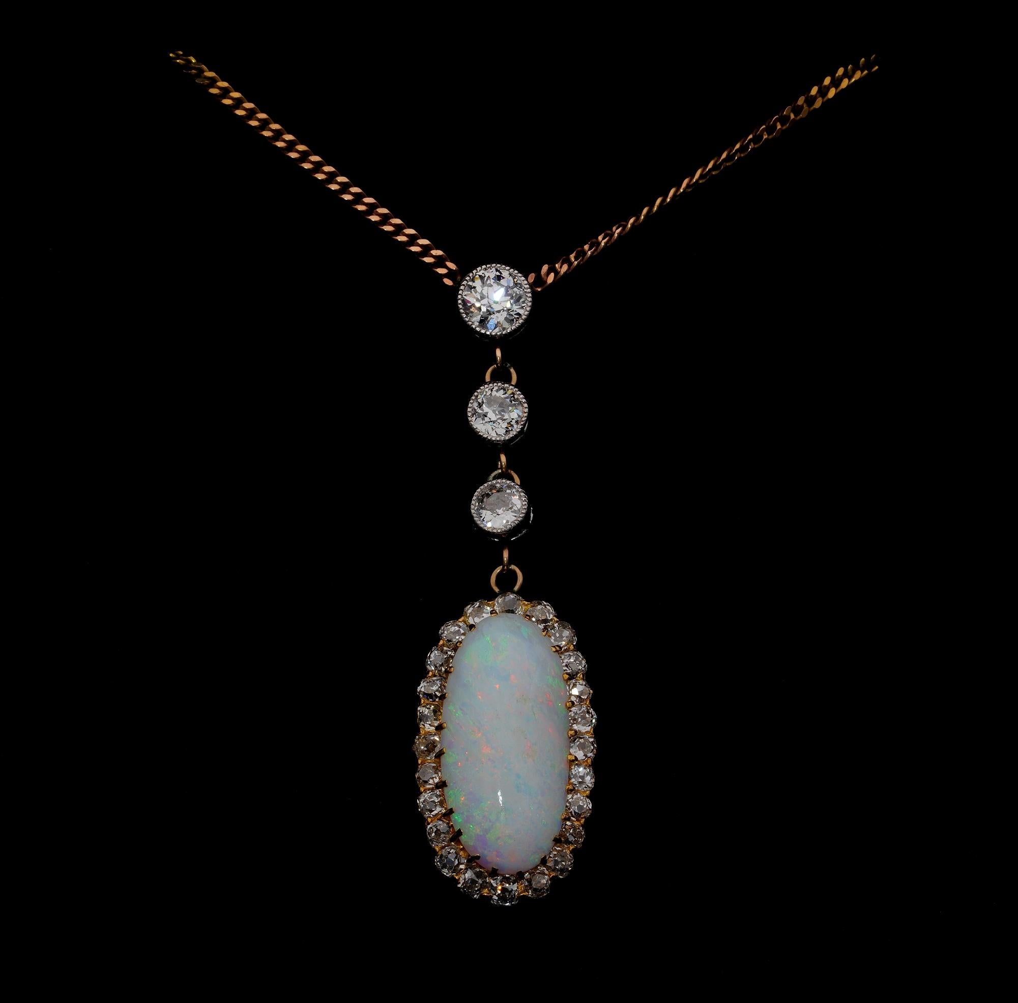 This gorgeous Edwardian period necklace is 1910
Fine hand crafting of 18 KT / Platinum matched with a 9 KT traditional chain as found
A lovely elongated pendant with a diamond line leading to the suspended Opal Pendant set in Diamonds halo
A 6.00