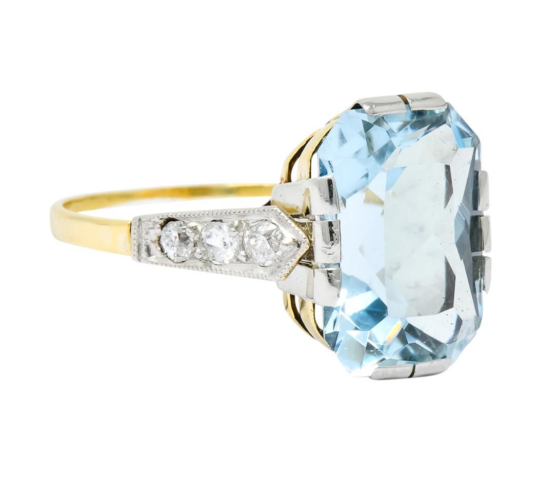 Cathedral style ring with basket setting featuring large polished platinum prongs

Centering a mixed cut aquamarine weighing approximately 6.00 carats, transparent and medium slightly greenish-blue in color

Flanked by platinum-topped pointed