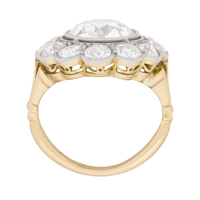 This opulent Edwardian era ring centres a marvellous 3.80 carat Old European Cut diamond within a lavish Old Cut 2.60ct diamond border, bringing the total diamond weight to a breathtaking 6.40 carats! These old cut diamonds are unobtrusively rubover