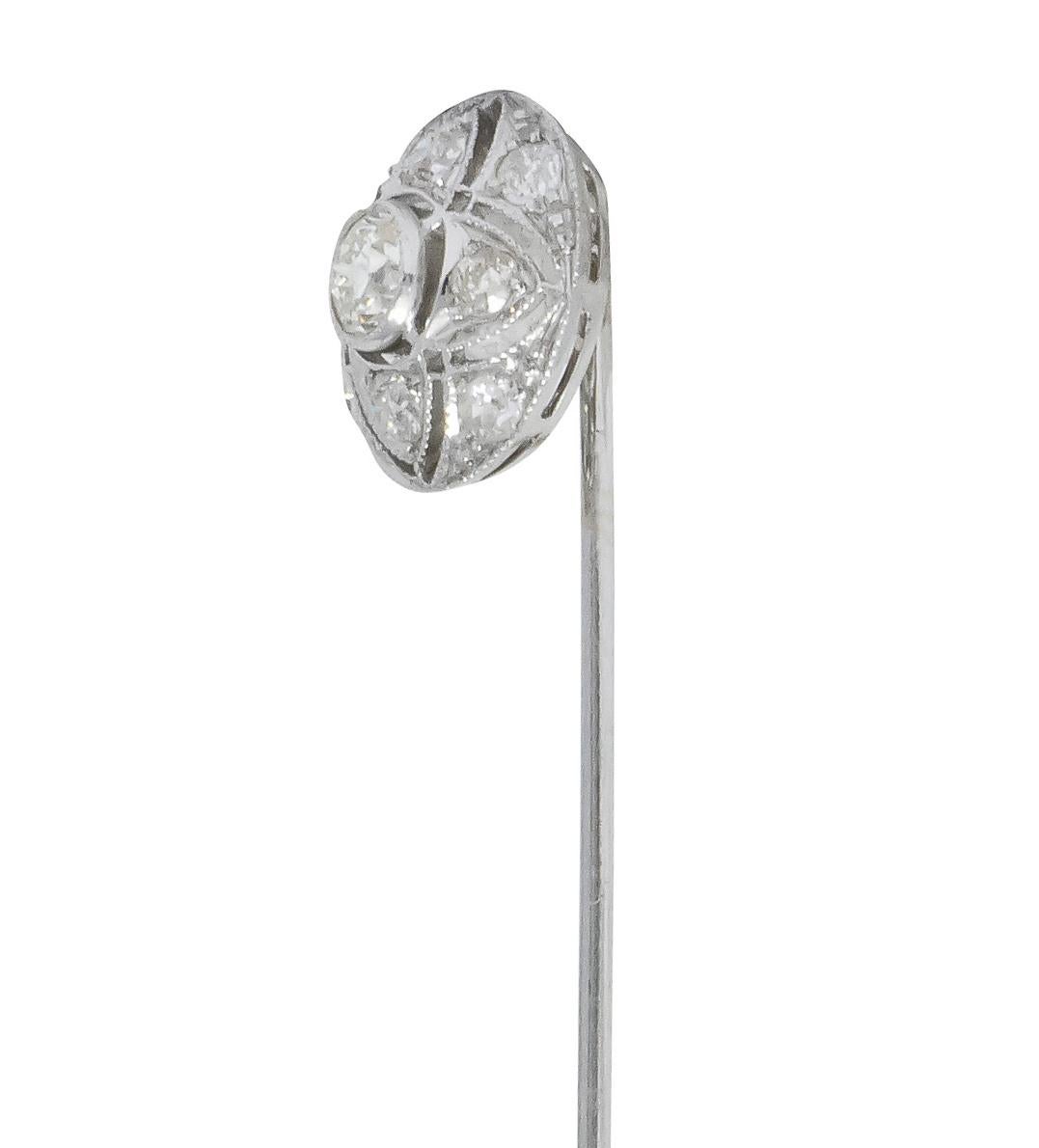 Designed as a dome with millegrain and pierced out quatrefoil design

Centering a bezel set old European cut diamond weighing approximately 0.42 carat, K color and VS clarity

Surrounded by eight bead set old European cut diamonds weighing