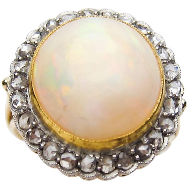 Edwardian 8 Carat White Opal Cabochon and Rose-Cut Diamond 14KT Gold Halo Ring For Sale